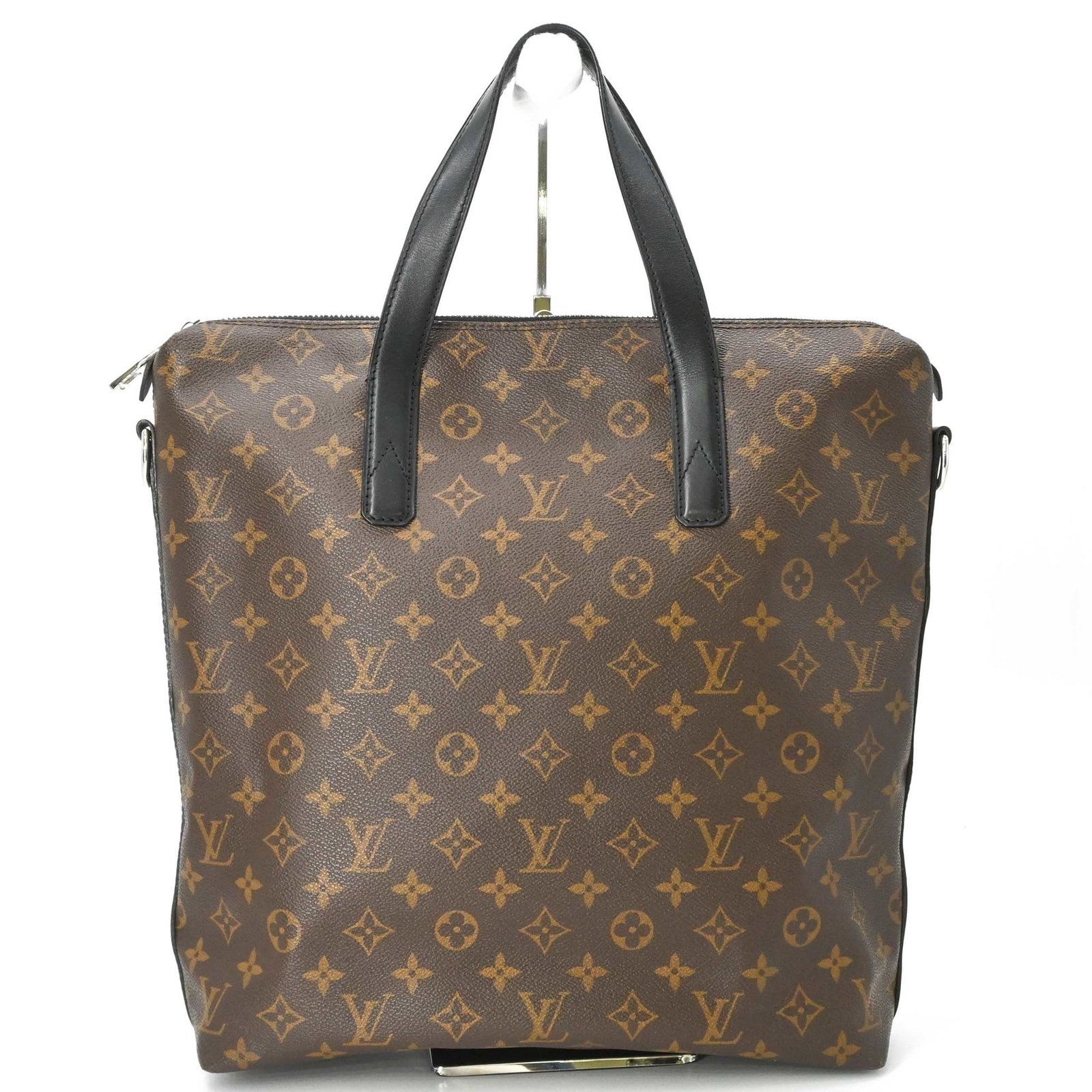 Louis Vuitton Tote Bag Monogram: Louis Vuitton Tote Bag Monogram The Louis Vuitton Tote Bag Monogram in brown features the iconic monogram Macassar pattern, adding a touch of classic elegance to any outfit. With its sturdy 36cm x 38c