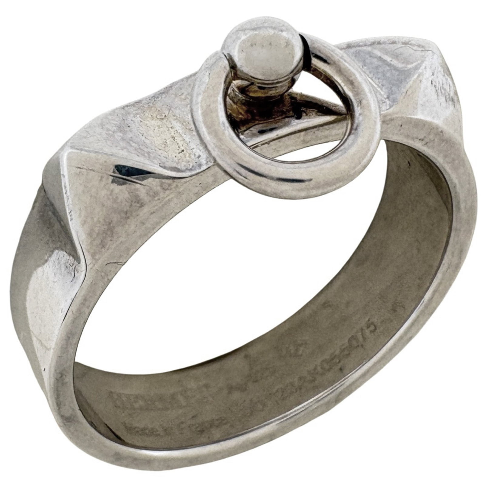 Hermes Band Ring Silver 925: Hermes Band Ring Silver 925 Silver 925 band ring from Hermes features a sleek design. The item shows signs of use, with minor scratches and dirt, but remains in good condition overall. This used silve