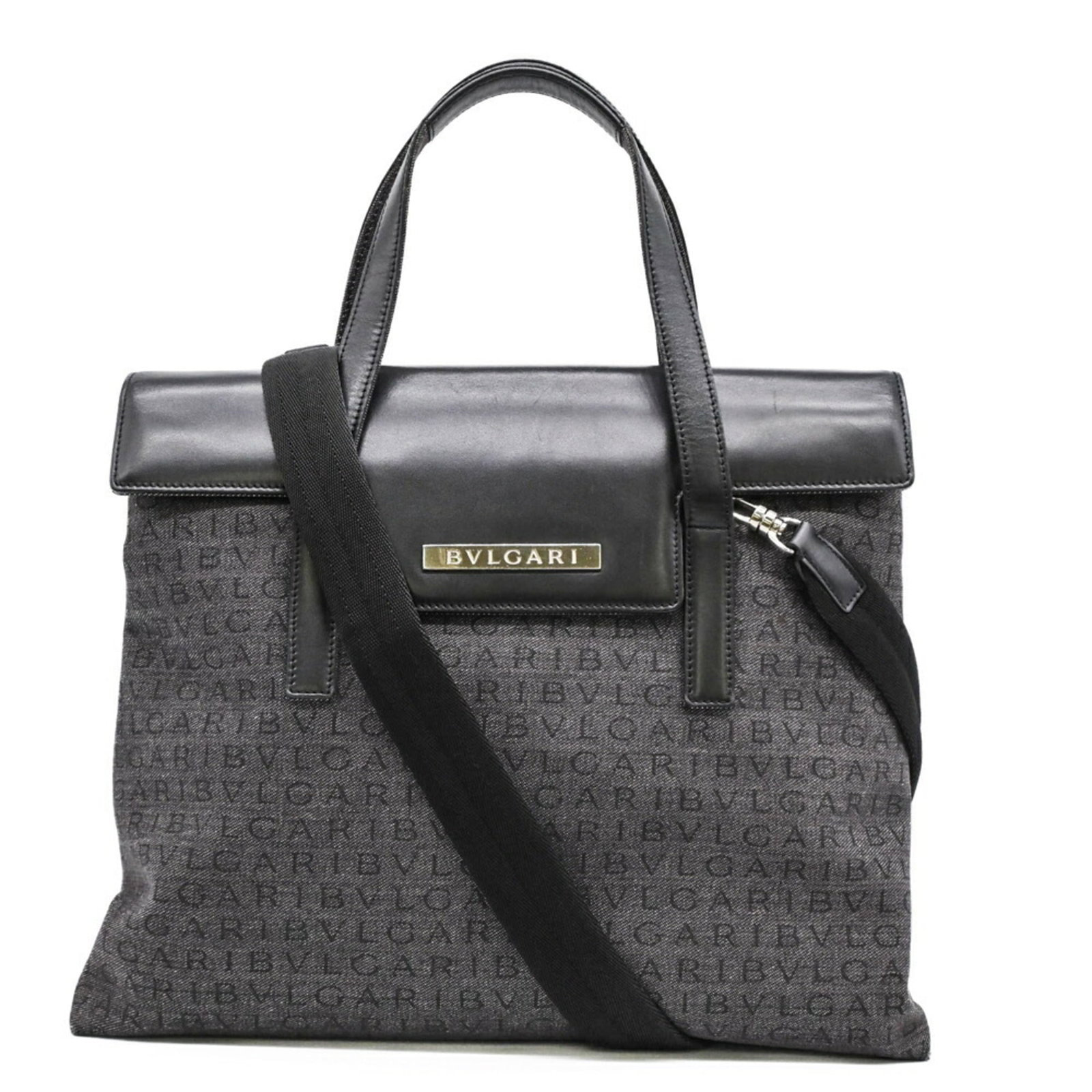 Bvlgari Handbag Canvas Leather: Bvlgari Handbag Canvas Leather Canvas and leather blend in this Bvlgari handbag, available in black and gray. Measuring 28cm x 38cm x 11cm, its compact size makes it easy to carry. With a few traces o