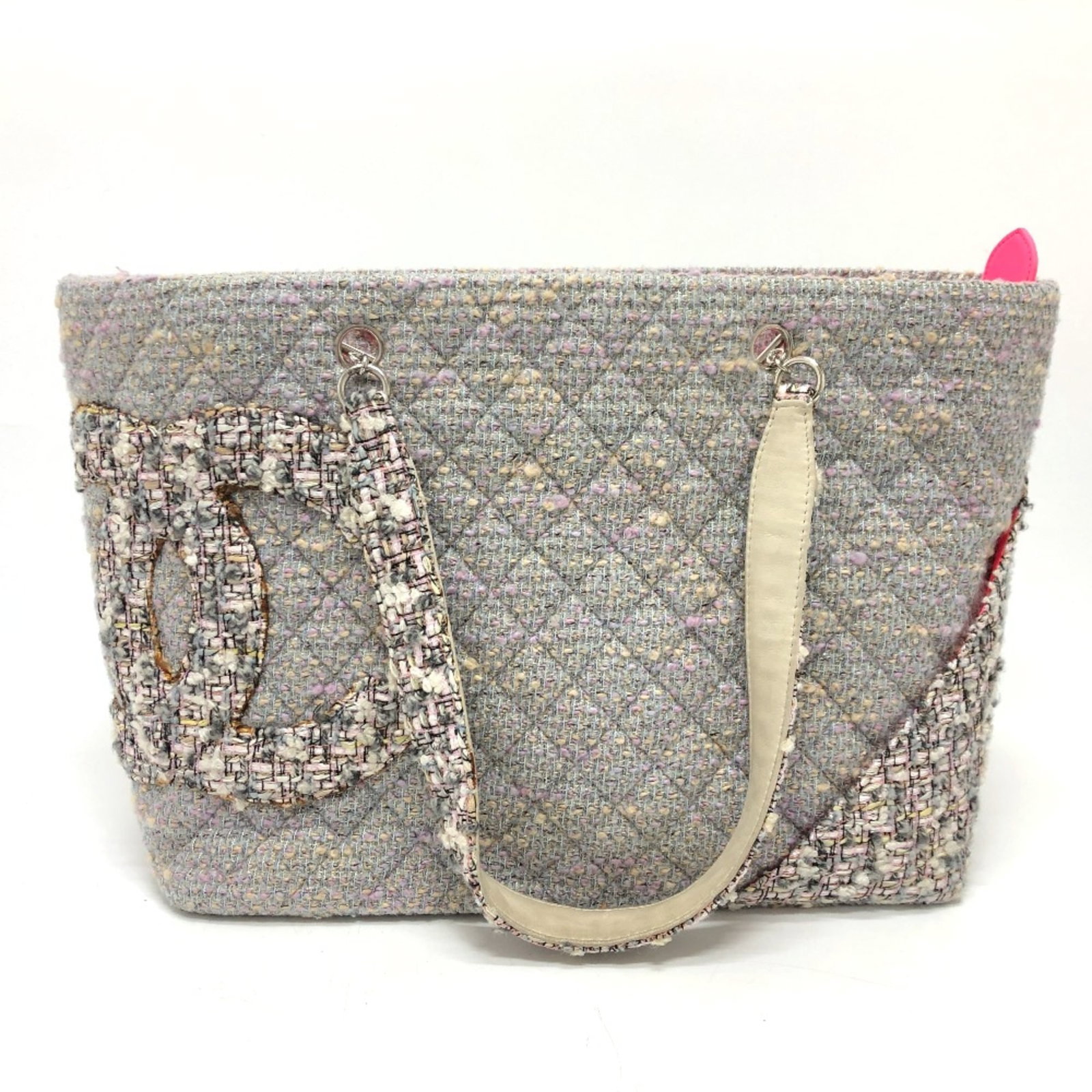 Chanel Tote Bag Tweed: Chanel Tote Bag Tweed The Chanel Tote Bag Tweed features a rich purple tweed material and measures 45.5cm wide, 27cm tall, and 15cm deep. With its sturdy handle at 22 inches long, this tote bag