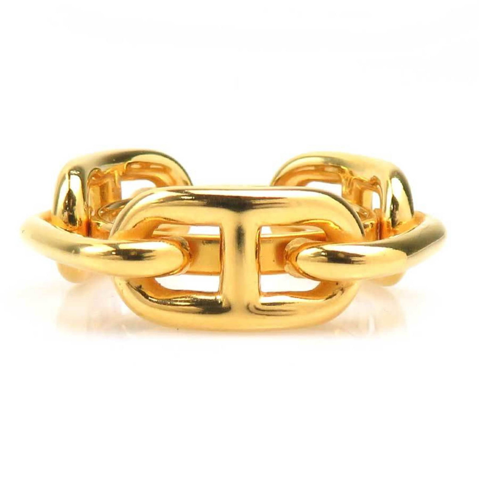 Hermes Scarf Ring Metal: Hermes Scarf Ring Metal The Hermes Scarf Ring Metal features a gold metal design with a scarf motif. Traces of usage are evident, including scratches and dirt, but overall the item remains in good