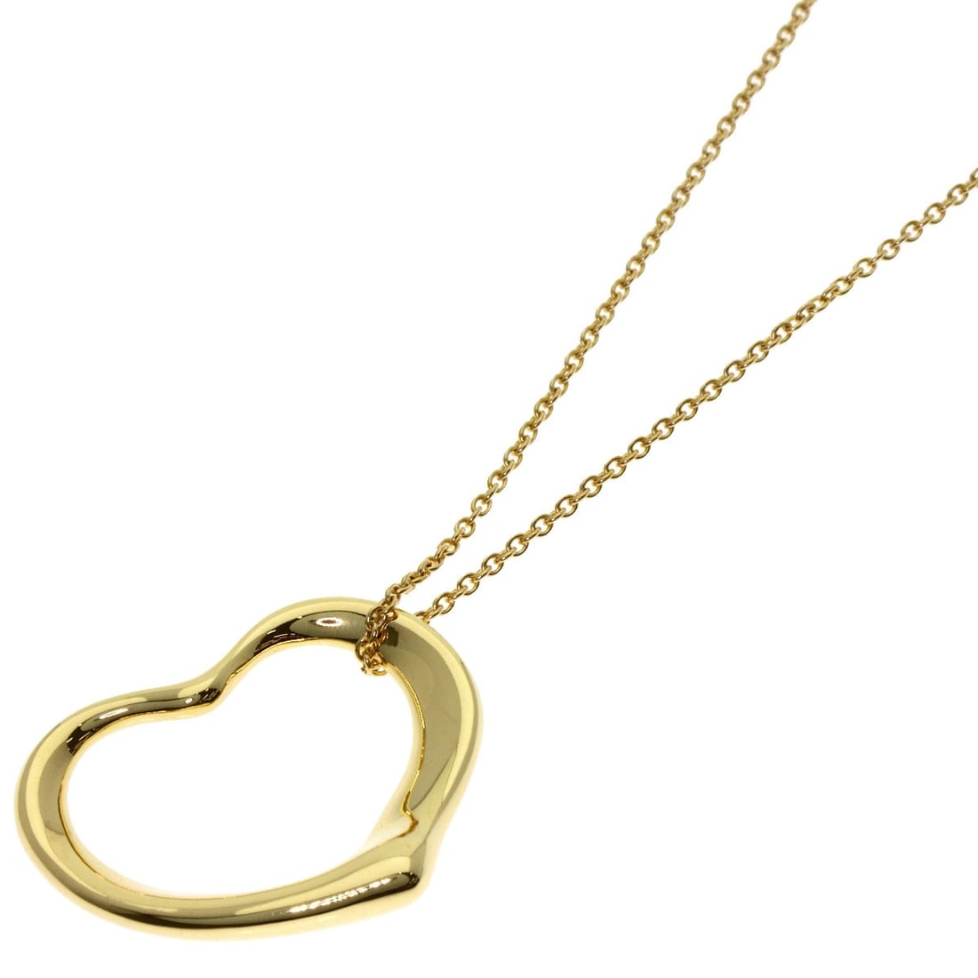 Open Heart Necklace Tiffany Co K18 Yellow Gold: Open Heart Necklace Tiffany Co K18 Yellow Gold Tiffany & Co's K18 Yellow Gold Open Heart Necklace boasts a sleek and sophisticated design, featuring a gold metal exterior with no stone. Measuring 15.3