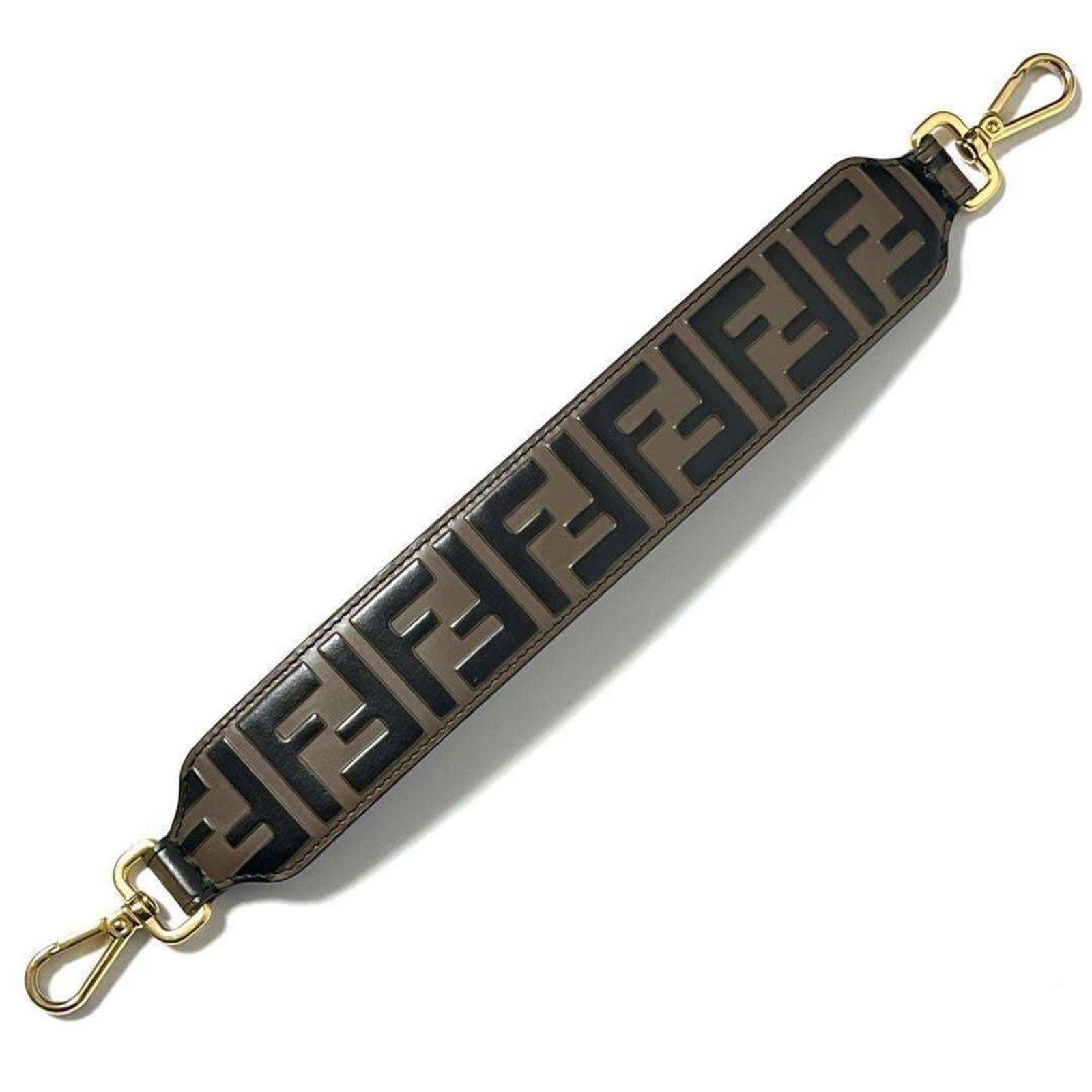 Fendi Strap Leather: Fendi Strap Leather Fendi Strap Leather is a high-quality, used leather strap with a rich history. Measuring 39cm in length, this strap boasts a classic design and premium feel. With some minor scratc