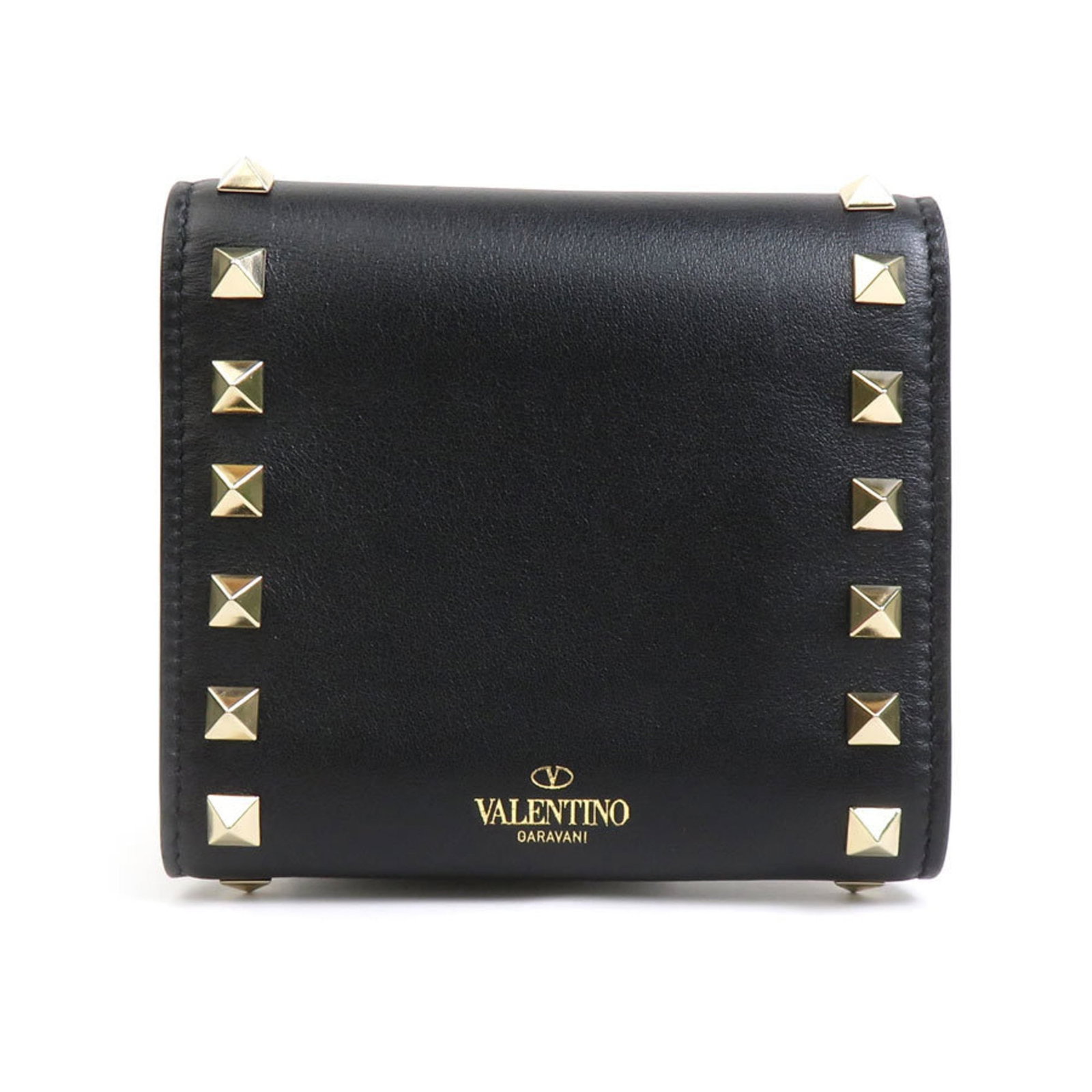 Valentino Garavani Wallet (Tri-Fold) Leather: Valentino Garavani Wallet (Tri-Fold) Leather Tri-fold leather wallet from Valentino Garavani features a sleek black design with subtle scratches and minor dirt marks. Made of high-quality leather, thi