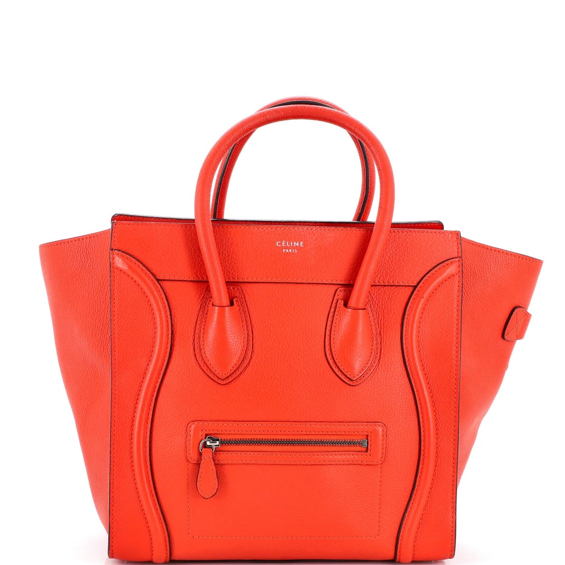 Luggage bag in grainy leather mini: Luggage bag in grainy leather mini Heavy corner wear and scuffs adorn this grainy leather mini luggage bag in red, adding a worn charm to its exterior. The interior features a vibrant orange-red micro