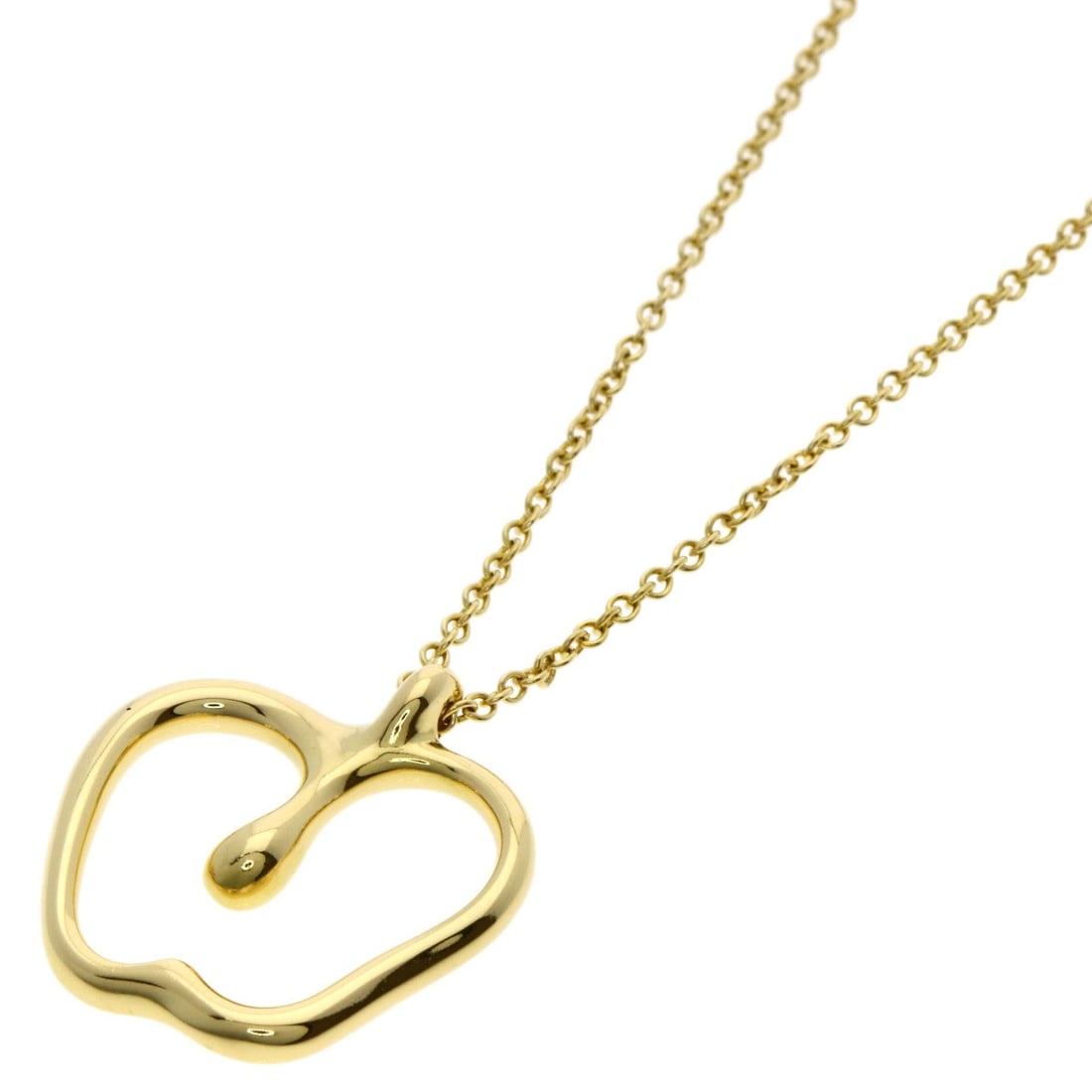 Tiffany & Co Apple Necklace in 18k Yellow Gold: Tiffany & Co Apple Necklace in 18k Yellow Gold Tiffany & Co's iconic Apple Necklace shines in 18k Yellow Gold, its sleek design crafted from high-karat metal. Measuring 15.9 inches in length, this ele