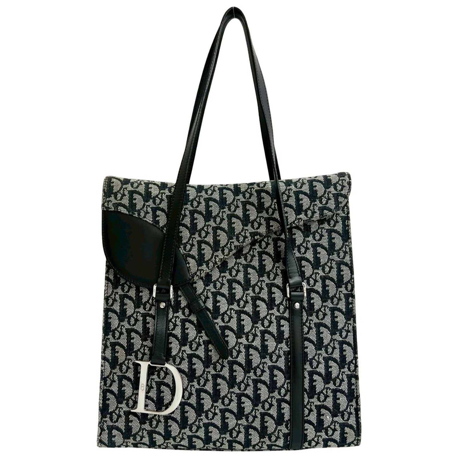 Christian Dior Tote Bag Canvas Leather: Christian Dior Tote Bag Canvas Leather Canvas and leather combine in this classic Christian Dior tote bag, featuring a timeless black design. The bag's canvas material provides a sturdy base, while th