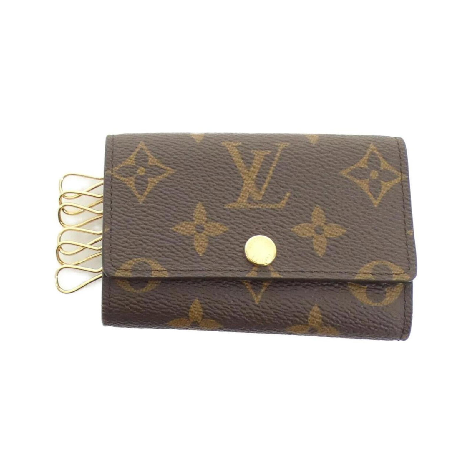 Louis Vuitton Keycase Coated Canvas: Louis Vuitton Keycase Coated Canvas The Louis Vuitton Keycase Coated Canvas features a classic design with a subtle Marron color. With its coated canvas material and slight traces of usage, this keyca