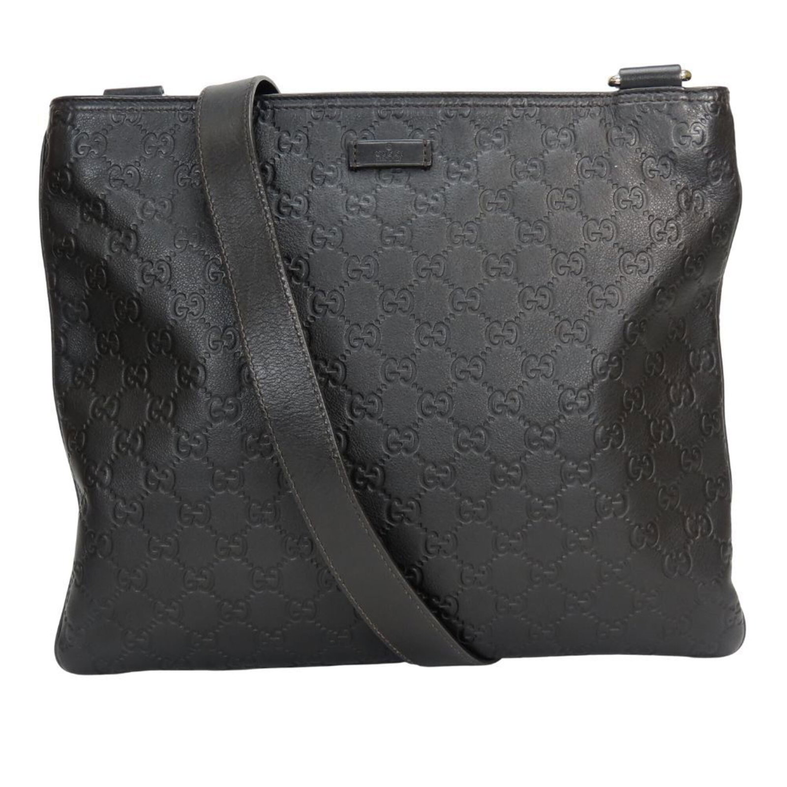 Gucci Shoulder Bag Leather: Gucci Shoulder Bag Leather This Gucci shoulder bag features high-quality black leather and an open closure, with a zippered pocket for added convenience. The bag has some signs of usage, including scr