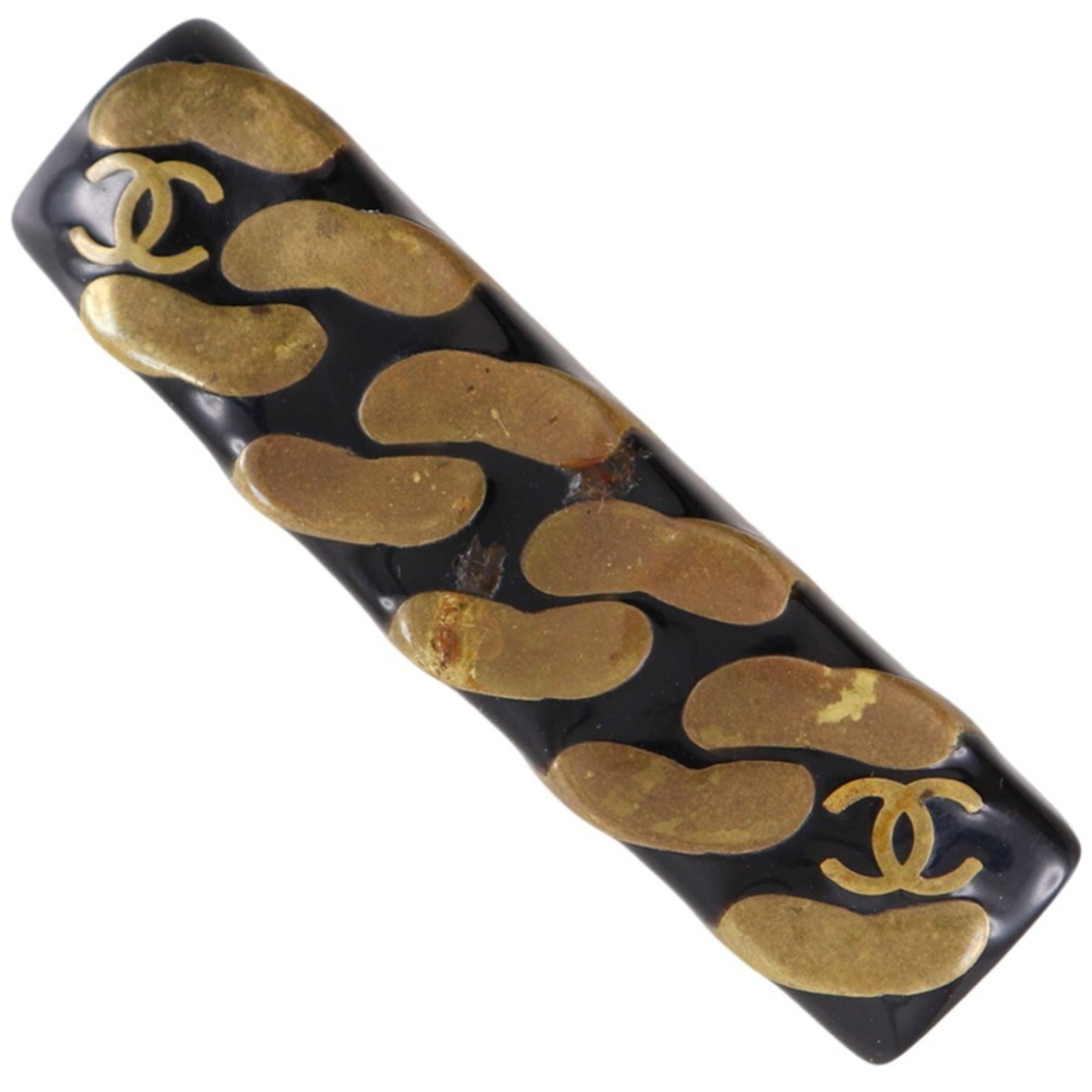 Chanel Barrette Plastic: Chanel Barrette Plastic This Chanel barrette is made of plastic and features a sleek black design with gold accents. Measuring 1.5cm x 6cm, it has a distinctive shape that adds a touch of luxury to an