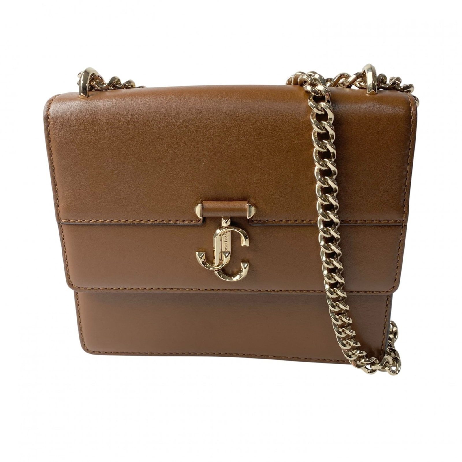 Jimmy Choo Shoulder Bag Leather: Jimmy Choo Shoulder Bag Leather The Jimmy Choo Shoulder Bag Leather boasts a rich brown leather exterior with subtle scratches and minor dirt marks, adding to its authentic used condition. Measuring 1