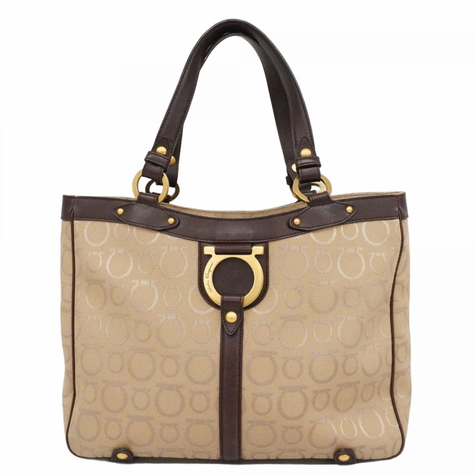 Salvatore Ferragamo Tote Bag Canvas: Salvatore Ferragamo Tote Bag Canvas Canvas tote bag from Salvatore Ferragamo with a classic beige color and gold hardware. This pre-owned bag features a timeless design and has been well-loved, with