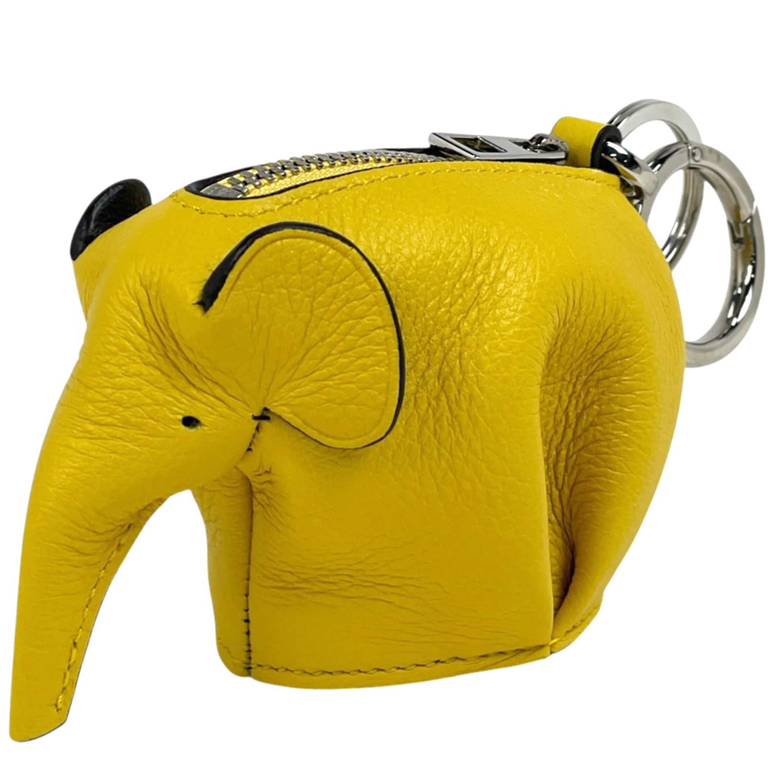 Loewe Coin Purse/Coin Case Leather: Loewe Coin Purse/Coin Case Leather Yellow Loewe Coin Purse/Coin Case Leather. This used coin purse features a classic design with yellow leather and measures 7cm x 9.5cm x 4.5cm. It shows traces of us