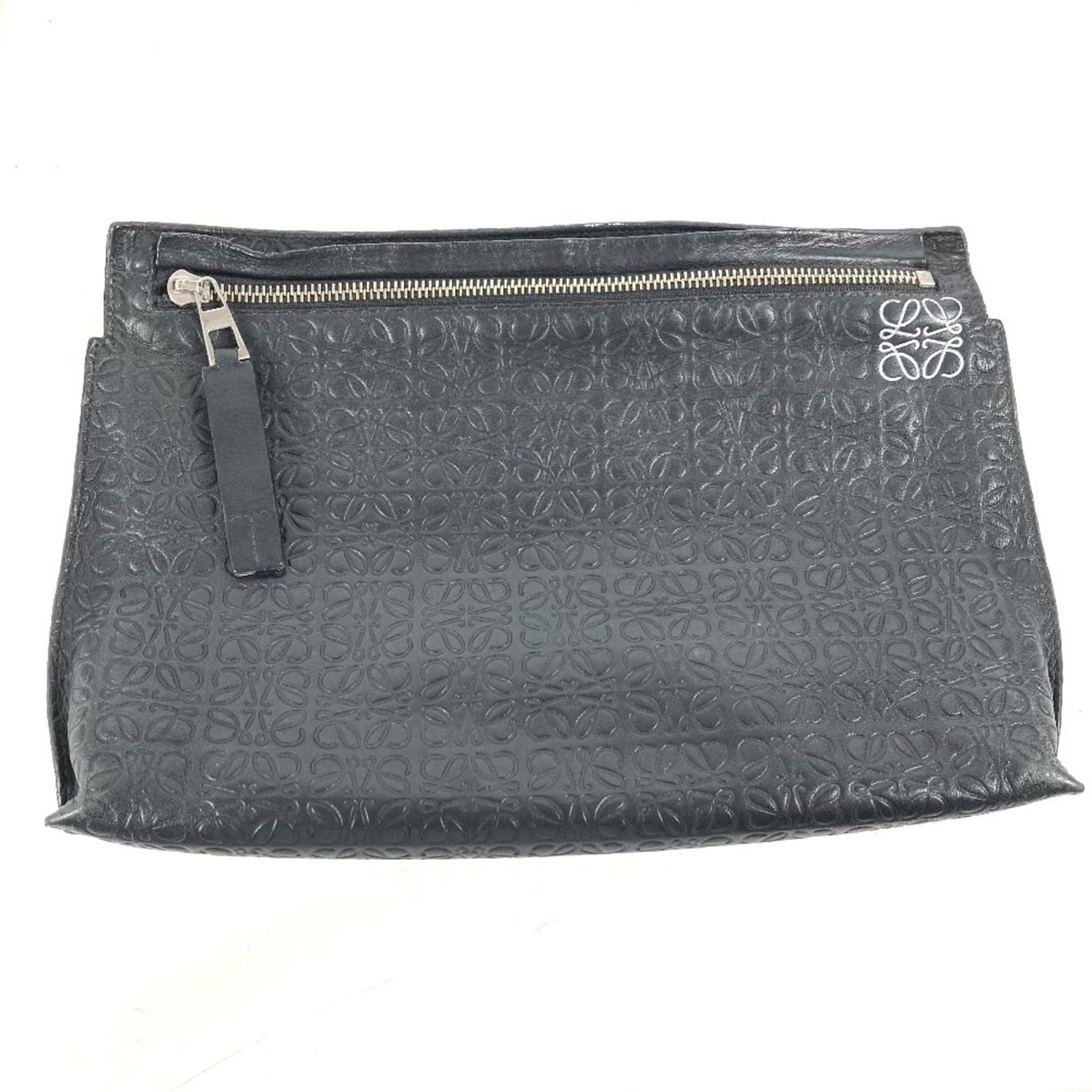 Loewe Clutch Bag Leather: Loewe Clutch Bag Leather This black Loewe clutch bag features a classic design with a zipper closure and measures 19cm x 28cm x 4.5cm. With its high-quality leather material, this stylish accessory