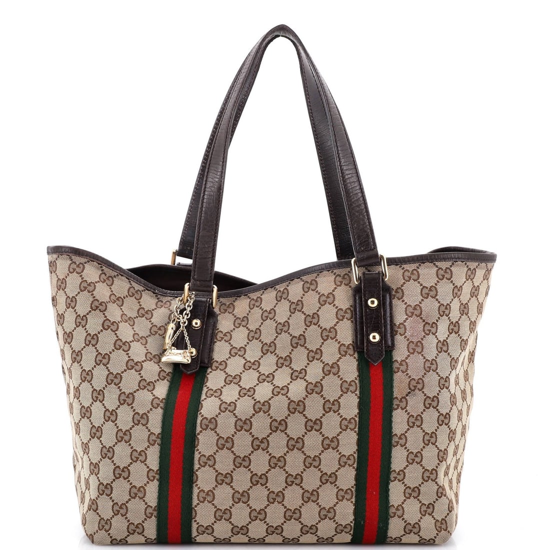 Canvas totes from gucci featuring jolicoeur design: Canvas totes from gucci featuring jolicoeur design Canvas tote from Gucci featuring Jolicoeur design in brown exterior with repainted leather trims and gold hardware. This large tote measures 11" tall