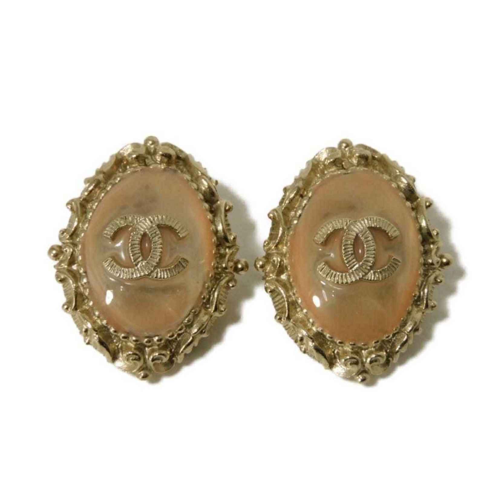 Chanel Clip Earrings: Chanel Clip Earrings Champagne Gold Clip Earrings from Chanel feature a beautiful color stone, adding a touch of elegance to any outfit. With their classic design and luxurious feel, these earrings ar