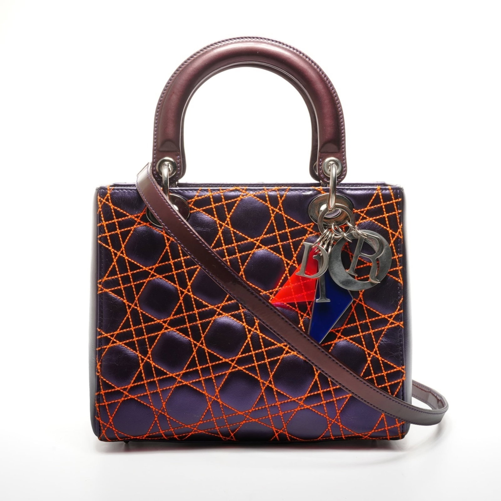 Christian Dior Handbag: Christian Dior Handbag This vibrant orange and purple Christian Dior handbag boasts a striking color combination. Measuring 20cm x 23cm x 10cm, its compact size belies its stylish charm. With a strap 