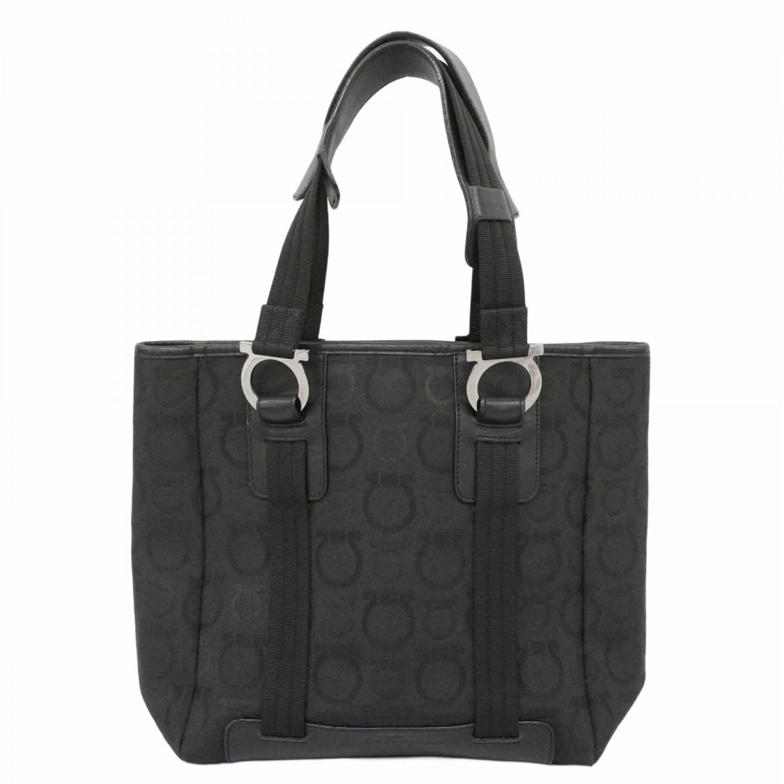 Salvatore Ferragamo Tote Bag Canvas: Salvatore Ferragamo Tote Bag Canvas Canvas tote bag from Salvatore Ferragamo in black with silver hardware. This used tote measures 26cm x 24cm x 12cm and shows traces of usage, including scratches an