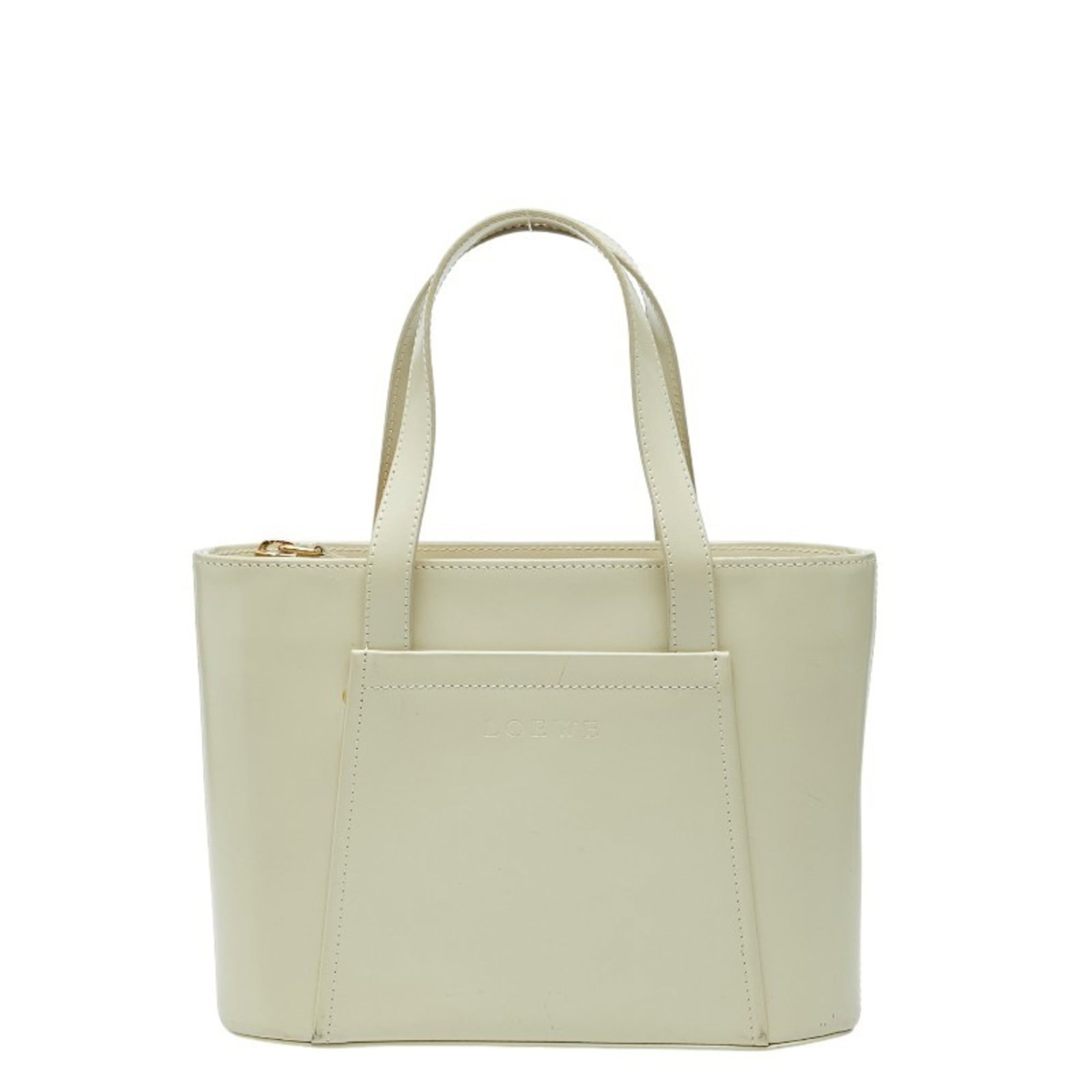 Loewe Handbag Leather: Loewe Handbag Leather The Loewe Handbag Leather is a unique and stylish accessory featuring off-white enamel leather with traces of usage. Its compact size makes it perfect for everyday carry, measuri
