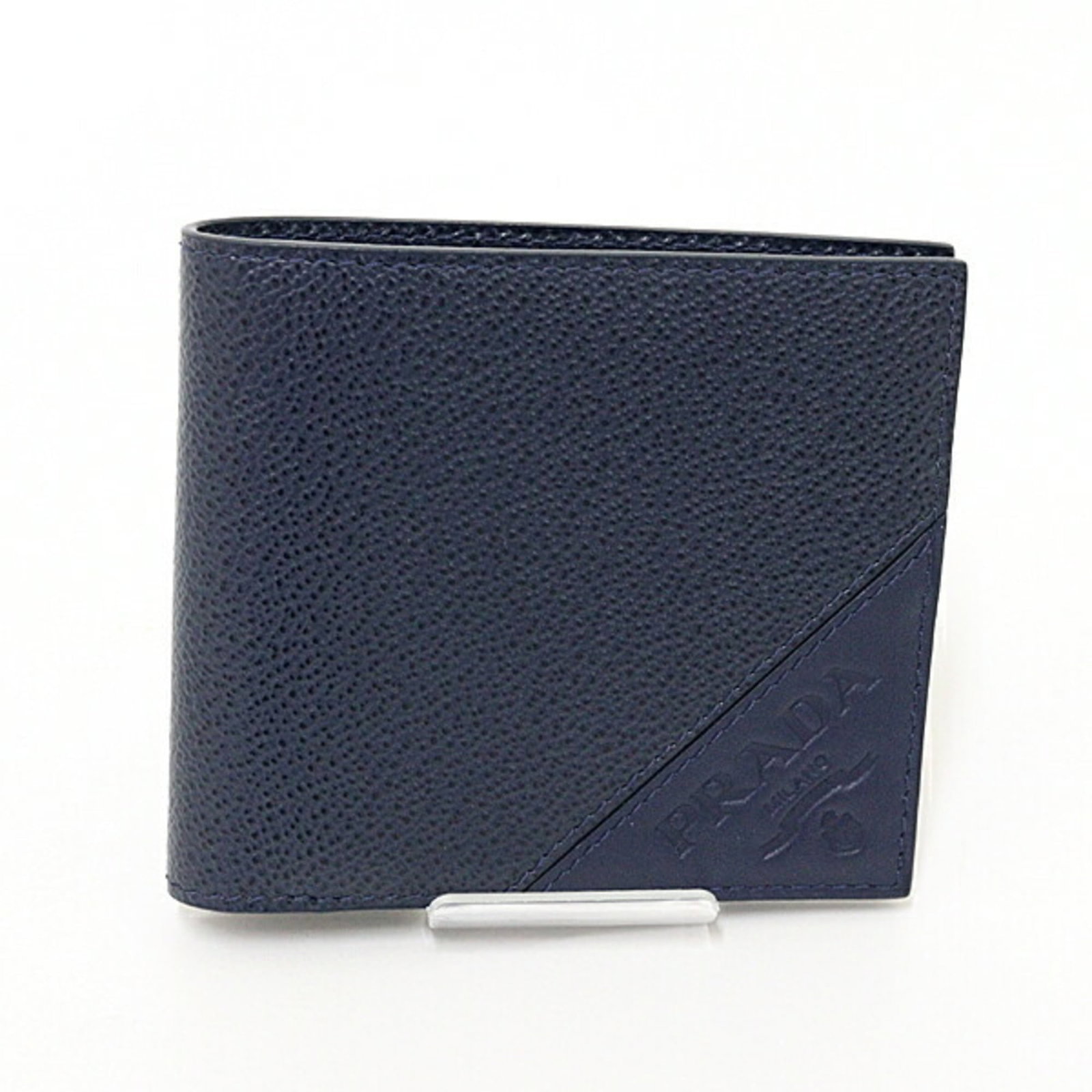 Prada Wallet (Bi-Fold) Saffiano: Prada Wallet (Bi-Fold) Saffiano Saffiano leather construction provides durability and resistance to scratches. This navy bi-fold wallet features classic Prada design with clean lines and minimal embel