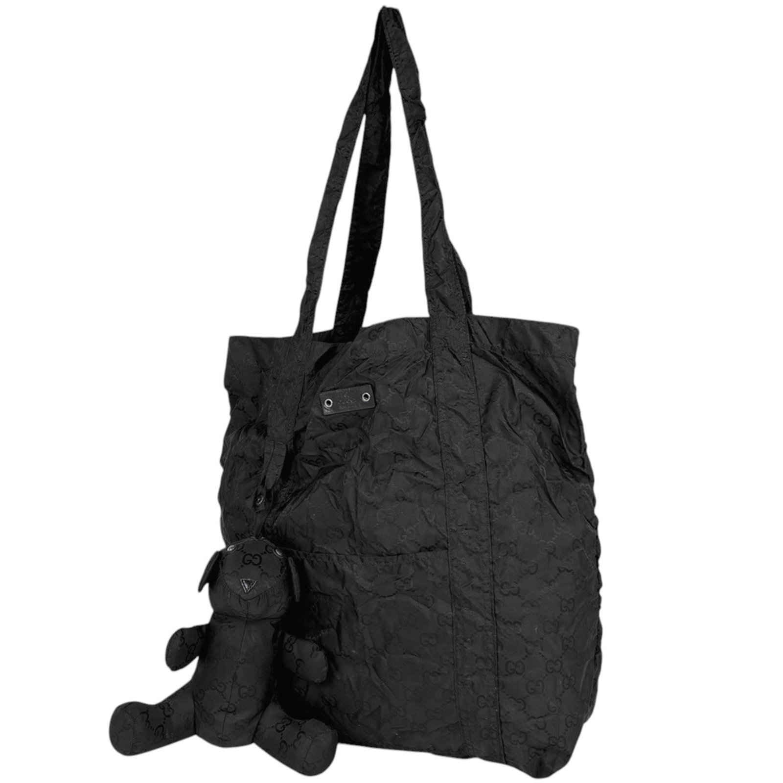 Gucci Eco-Bag Tote Bag Nylon: Gucci Eco-Bag Tote Bag Nylon Gucci's Eco-Bag Tote Bag Nylon boasts a sleek black design made from durable nylon material. This used tote bag has visible traces of usage and minor damages, making it a 