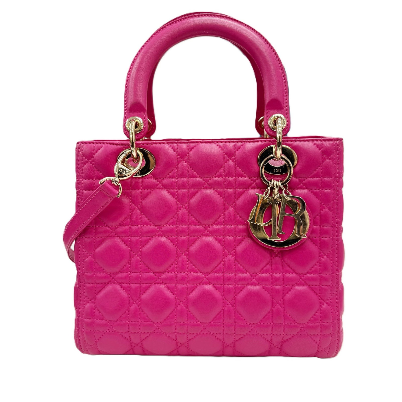 Christian Dior Shoulder Bag Leather: Christian Dior Shoulder Bag Leather The Christian Dior Shoulder Bag Leather features a striking pink lambskin exterior with visible traces of usage and minor scratches. Made from high-quality