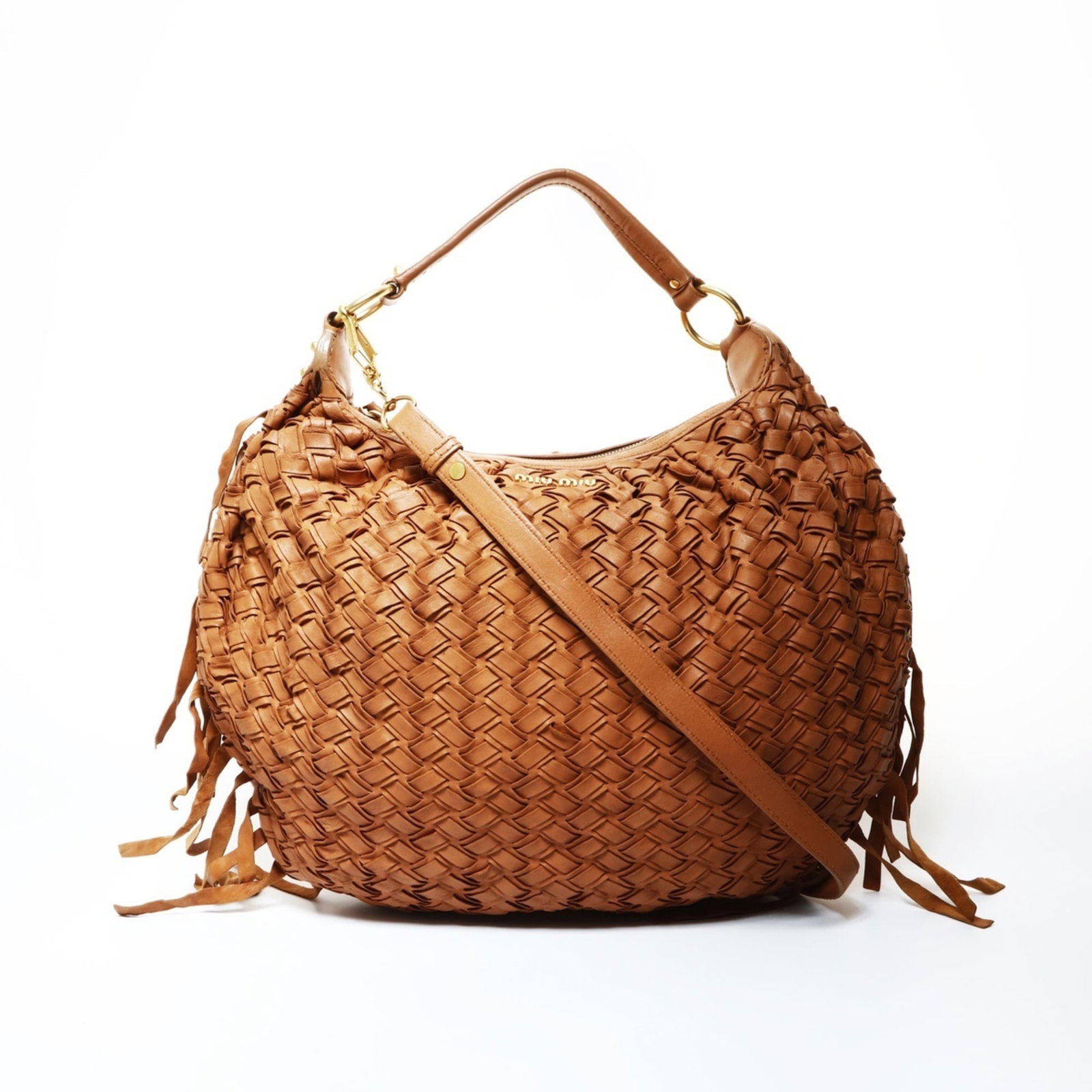 Miu Miu Shoulder Bag Leather: Miu Miu Shoulder Bag Leather This Miu Miu shoulder bag features high-quality brown leather construction with a classic design. The bag has some minor signs of usage, including scratches and dirt, but 