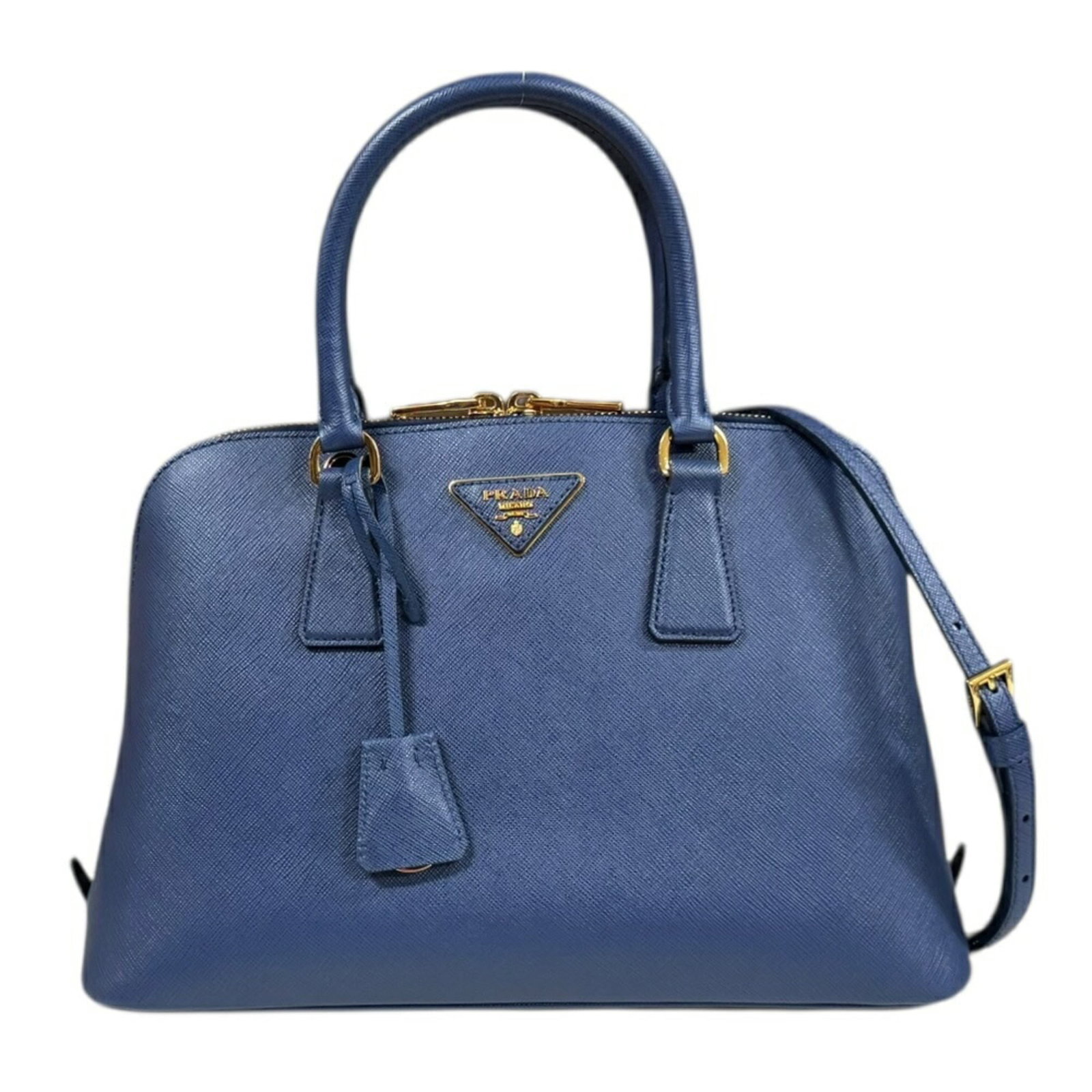 Prada Shoulder Bag Leather: Prada Shoulder Bag Leather This Prada shoulder bag features high-quality blue leather with visible scratches and dirt, giving it a worn-in look. The bag measures 21cm x 32cm x 13.5cm and has been well