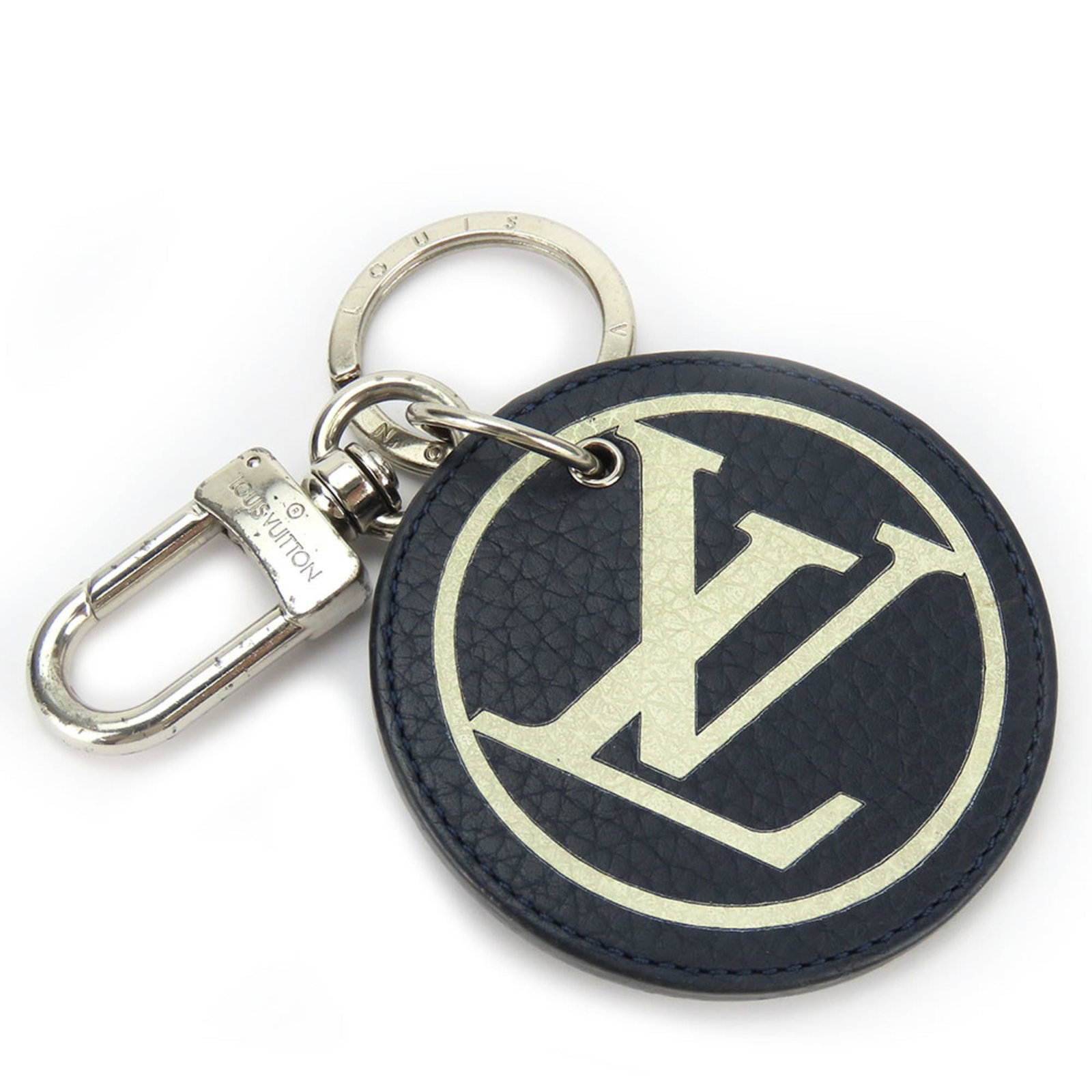 Louis Vuitton Keyring Leather: Louis Vuitton Keyring Leather Navy or White Louis Vuitton leather keyring in used condition, with traces of usage and minor damages/dirt visible. The keyring still retains its original charm despite s