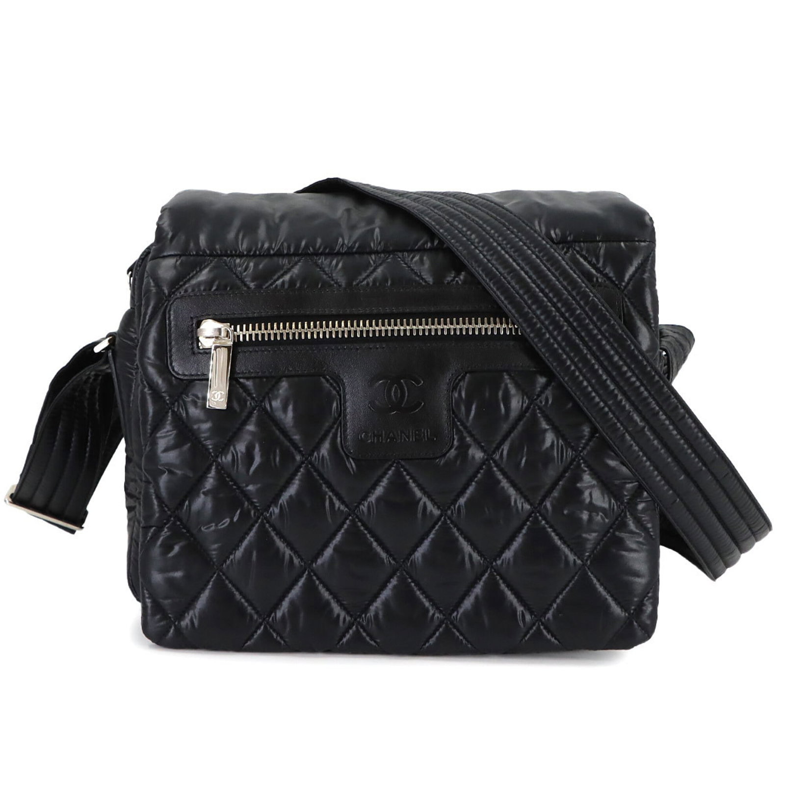 Chanel Handbag Shoulder Bag Nylon Leather: Chanel Handbag Shoulder Bag Nylon Leather The Chanel Handbag Shoulder Bag Nylon Leather is a sleek and stylish accessory in black. Measuring 21cm x 24cm x 11cm, this shoulder bag features a combinatio