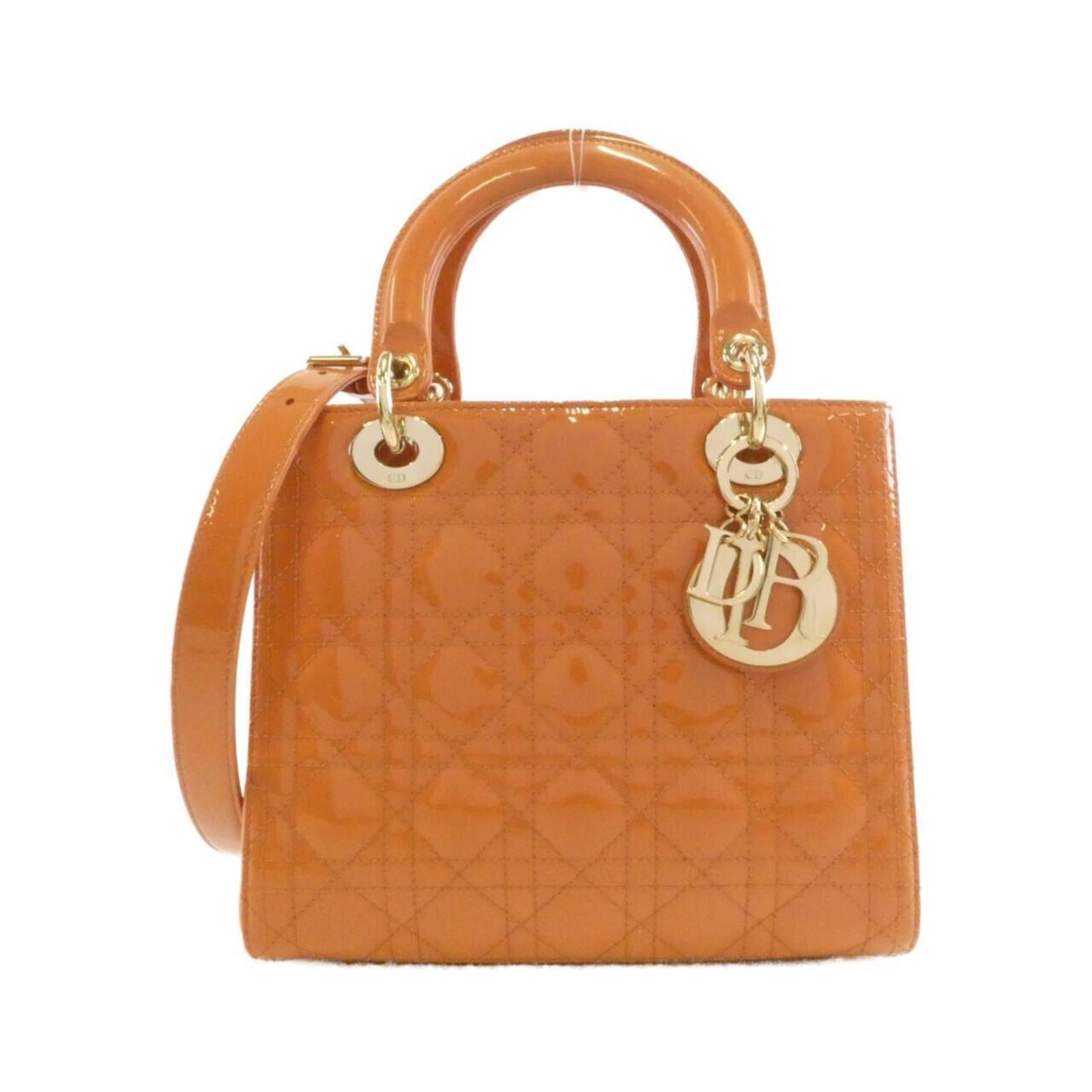 Christian Dior Handbag: Christian Dior Handbag The Christian Dior handbag boasts its vibrant orange hue and elegant gold hardware, making for a striking accessory. In excellent condition with only minor signs of wear, this b