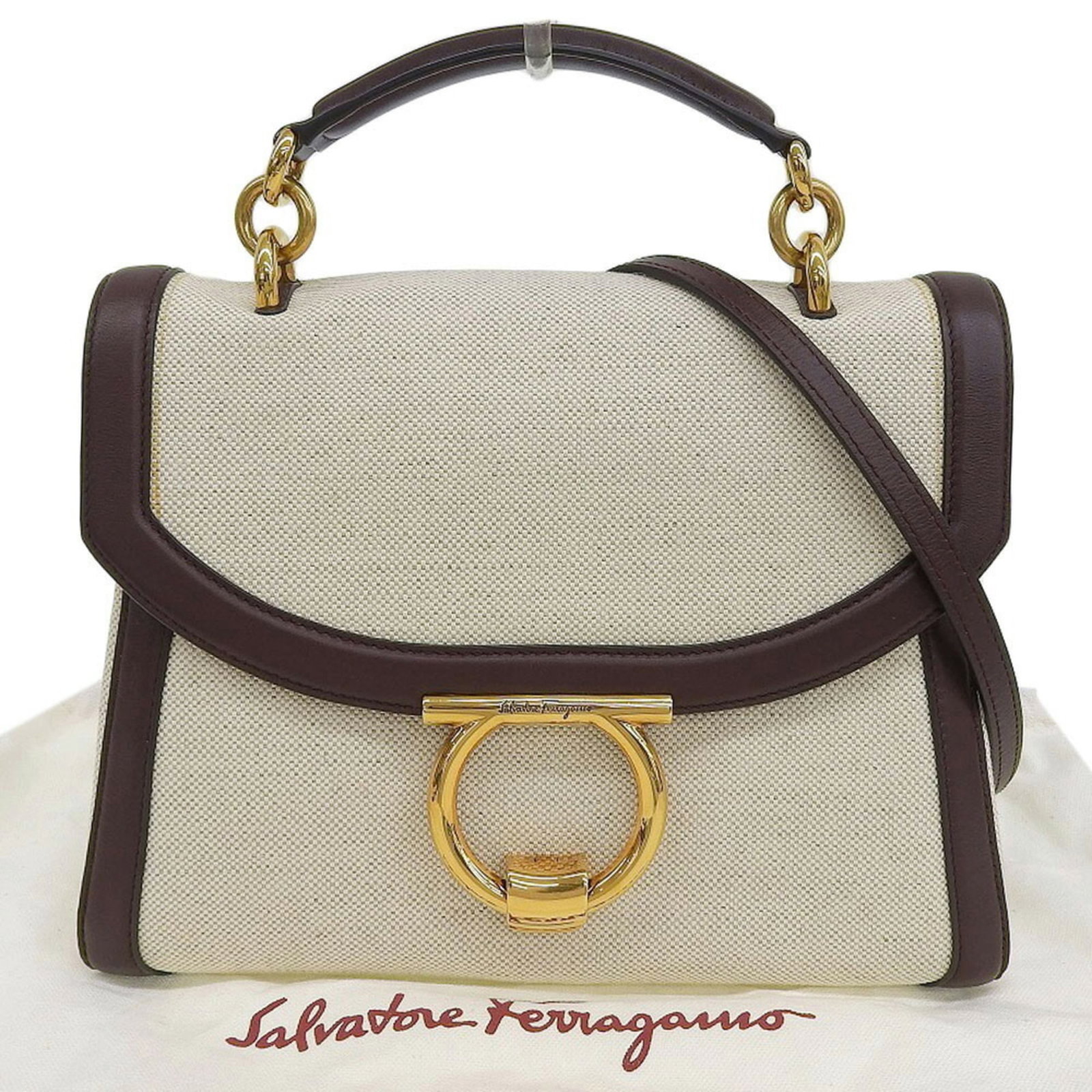 Salvatore Ferragamo Handbag Canvas Leather: Salvatore Ferragamo Handbag Canvas Leather This Salvatore Ferragamo handbag features canvas and leather construction in a classic beige and brown color combination. With its clean lines and timeless d