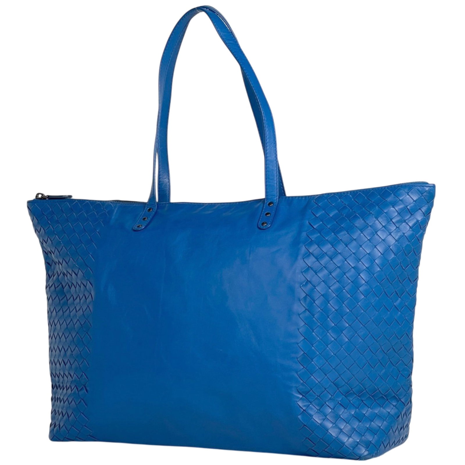 Bottega Veneta Tote Bag Leather: Bottega Veneta Tote Bag Leather Bottega Veneta's iconic tote bag in a stunning blue hue features high-quality leather construction, showcasing the brand's signature intrecciato weave. With its classic