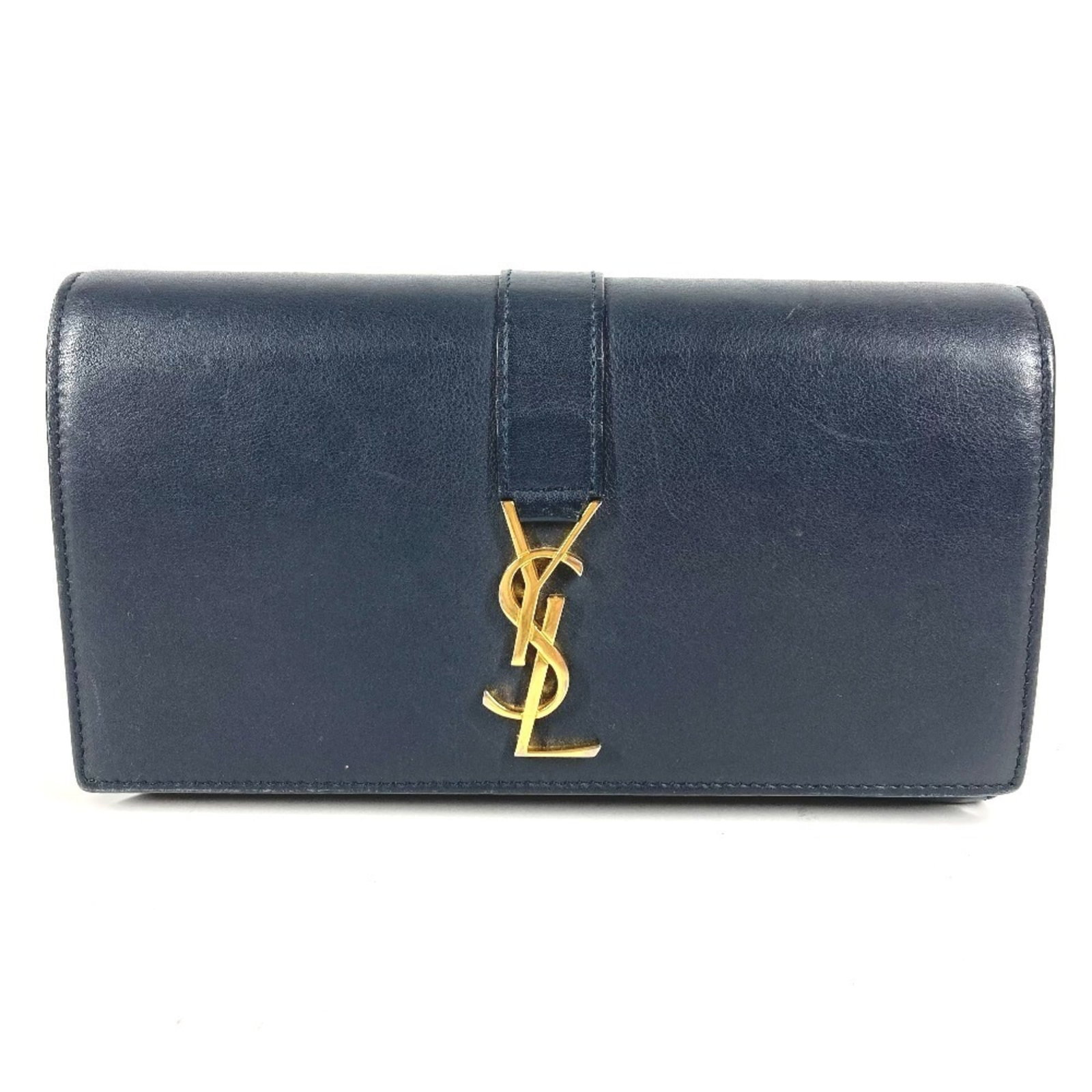 Yves Saint Laurent Long Wallet (Tri-Fold) Leather: Yves Saint Laurent Long Wallet (Tri-Fold) Leather Navy Yves Saint Laurent tri-fold leather wallet with classic design and durable construction. The used condition reveals some scratches and dirt, givi