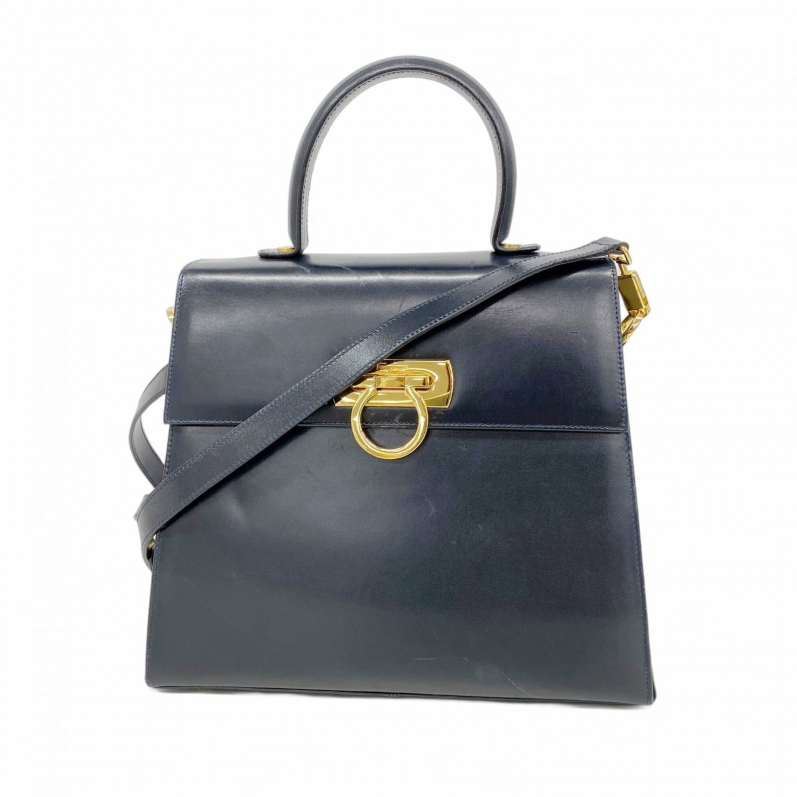 Salvatore Ferragamo Handbag Leather: Salvatore Ferragamo Handbag Leather This navy leather handbag from Salvatore Ferragamo features gold hardware and has been carefully crafted with high-quality materials. With its classic design and ti
