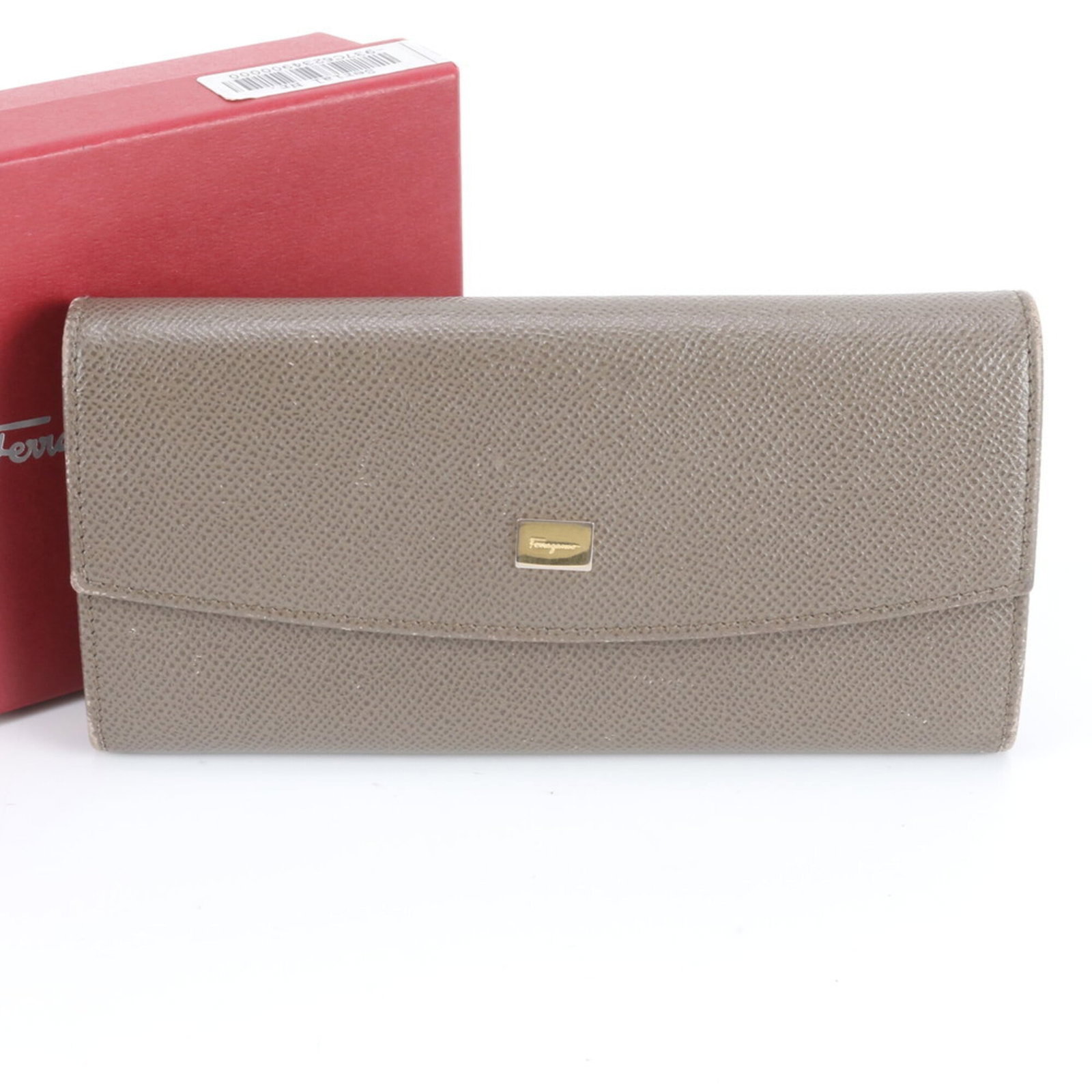 Salvatore Ferragamo Long Wallet (Bi-Fold) Leather: Salvatore Ferragamo Long Wallet (Bi-Fold) Leather The Salvatore Ferragamo Long Wallet (Bi-Fold) Leather features a classic design with a rich brown leather exterior. With its bi-fold layout and