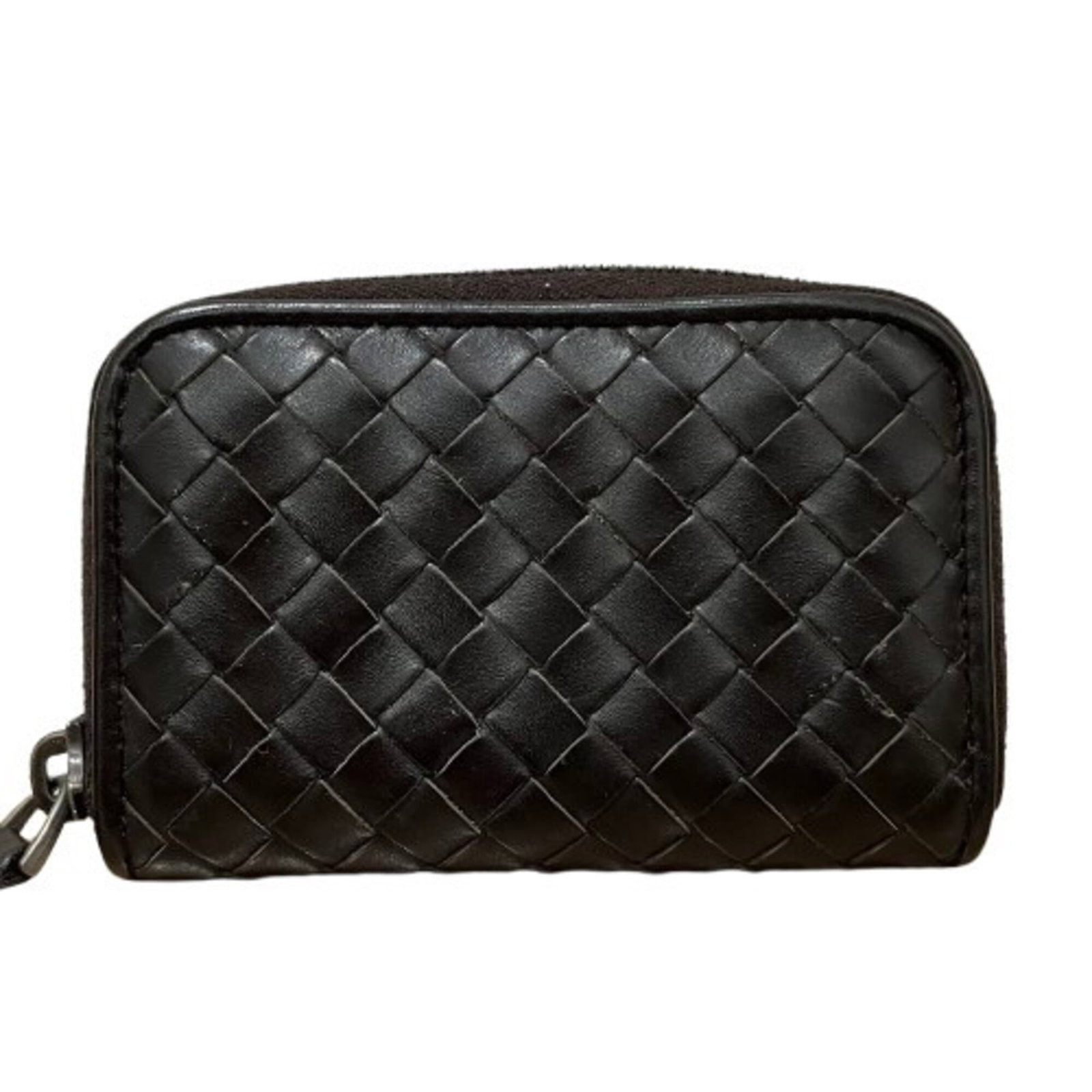 Bottega Veneta Coin Purse/Coin Case Leather: Bottega Veneta Coin Purse/Coin Case Leather The Bottega Veneta Coin Purse/Coin Case Leather is a classic, all-black leather accessory featuring a timeless design. With its sleek size and subtle