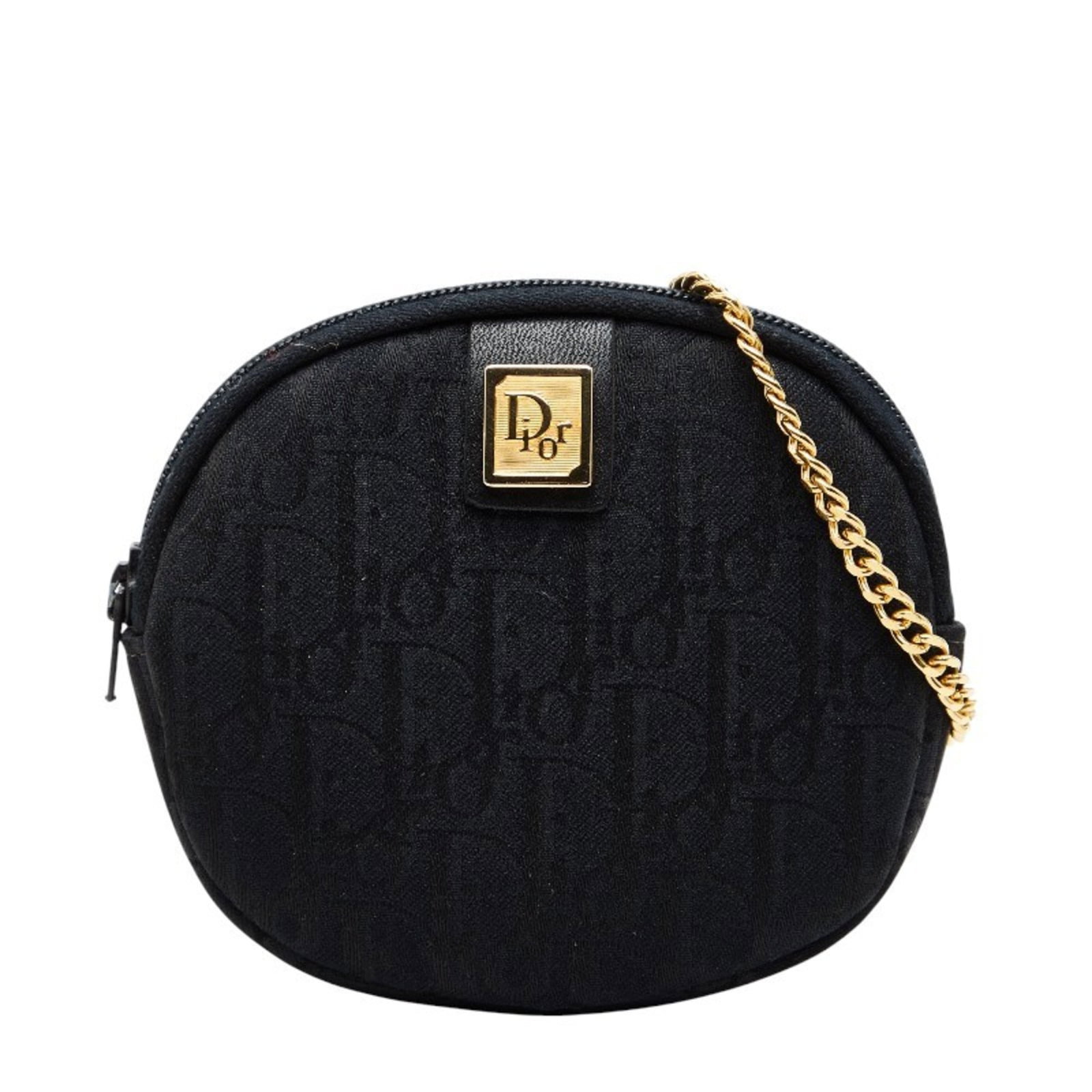 Christian Dior Coin Purse/Coin Case Canvas: Christian Dior Coin Purse/Coin Case Canvas This Christian Dior coin purse/case in canvas features a sleek black design. With its compact size and classic style, it's perfect for adding a touch of