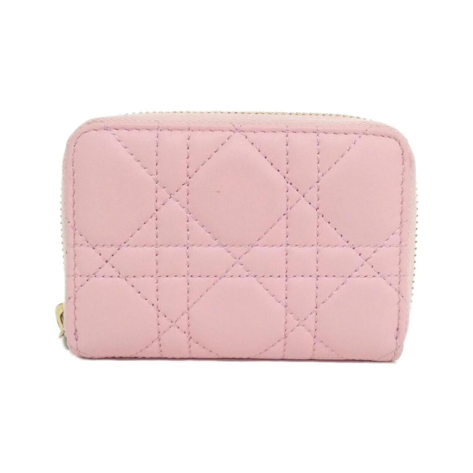 Christian Dior Coin Purse/Coin Case Leather: Christian Dior Coin Purse/Coin Case Leather This Christian Dior coin purse features elegant pink lamb leather and boasts a classic design. With its compact size and subtle sheen, it's perfect for addi