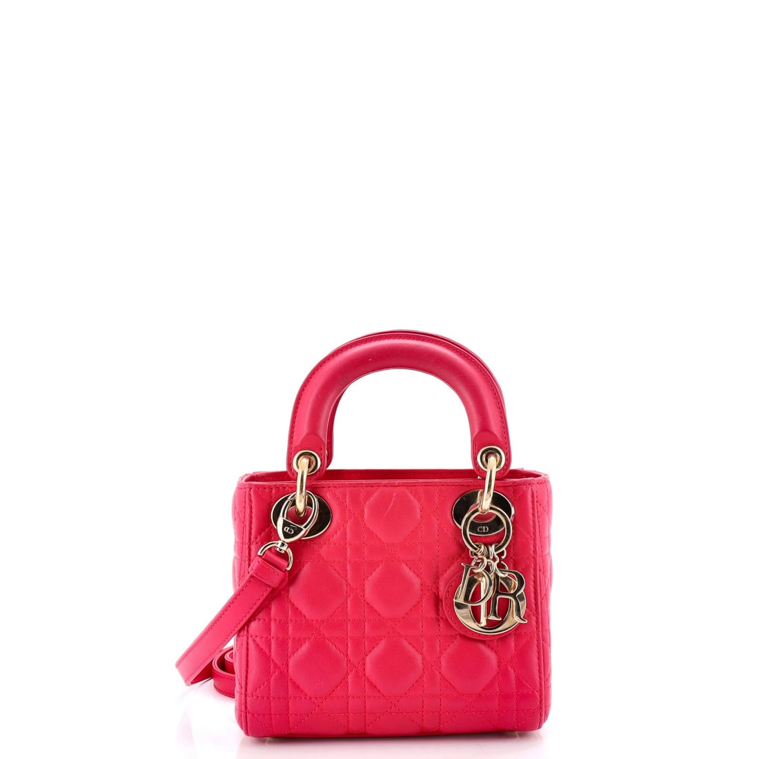 Christian Dior Lady Lambskin Cannage Bag Quilt Mini: Christian Dior Lady Lambskin Cannage Bag Quilt Mini The Christian Dior Lady Lambskin Cannage Bag Quilt Mini boasts a striking pink exterior and elegant gold-tone hardware. This compact, quilted bag fe
