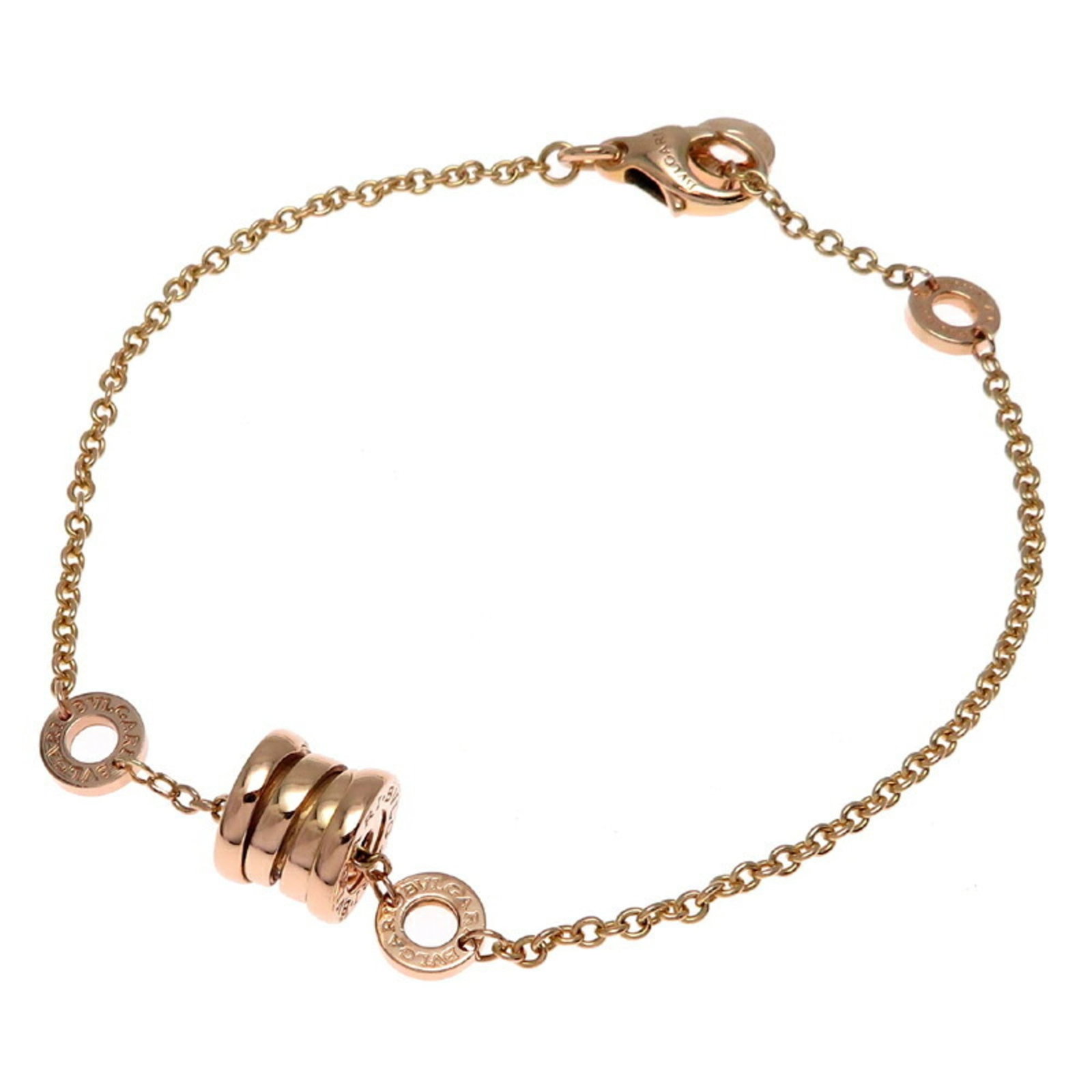 Bvlgari Charm Bracelet Pink Gold (18K): Bvlgari Charm Bracelet Pink Gold (18K) Bvlgari Charm Bracelet Pink Gold (18K) features a delicate pink gold chain with a few traces of usage, some scratches and dirt visible. The item is made from hig