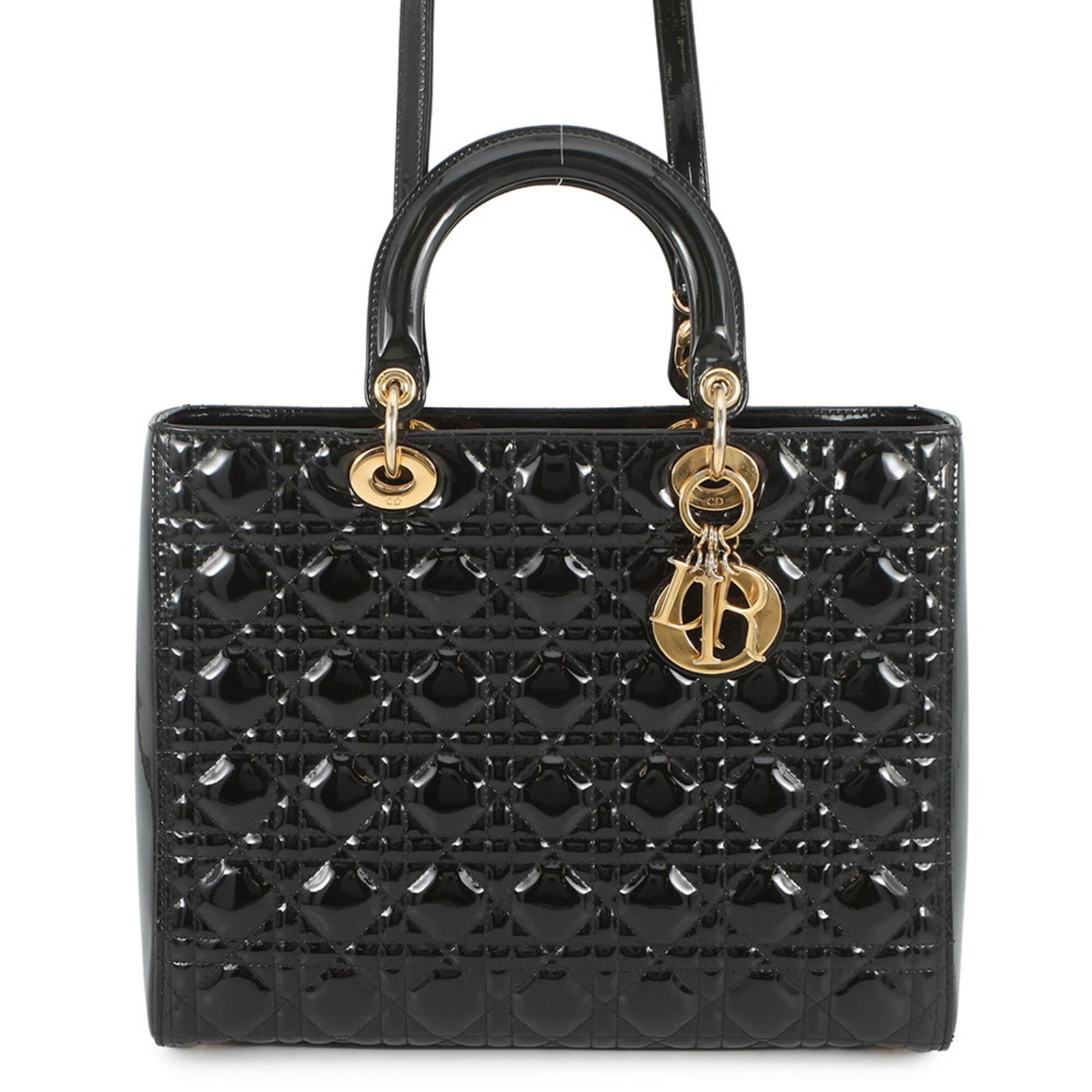 Christian Dior Handbag Patent Leather: Christian Dior Handbag Patent Leather Christian Dior Handbag Patent Leather. This black patent leather handbag features a classic design with a few traces of usage, some scratches and dirt visible.