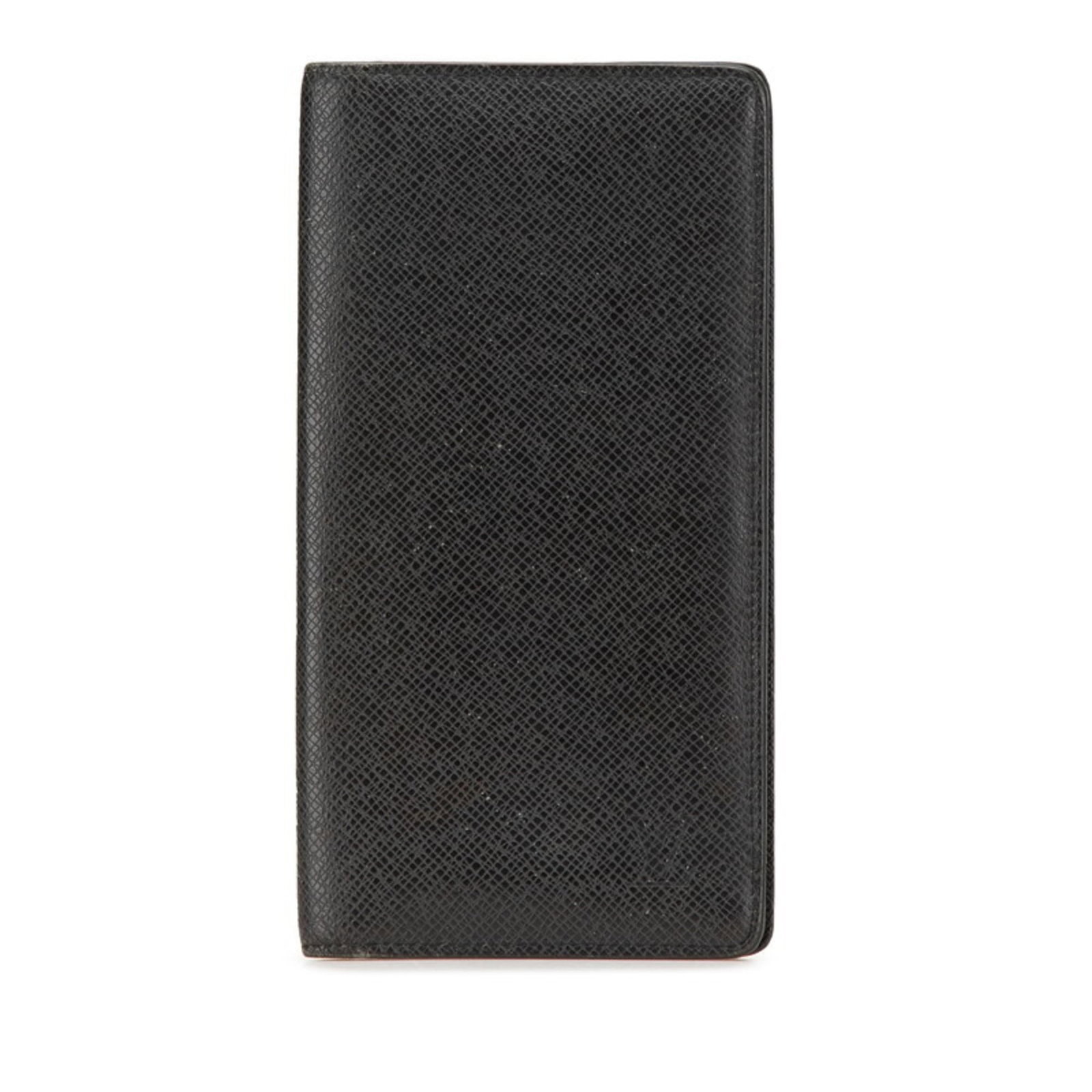 Louis Vuitton Coin Purse/Coin Case Taiga Leather: Louis Vuitton Coin Purse/Coin Case Taiga Leather The Louis Vuitton Coin Purse/Coin Case Taiga Leather is a sleek and sophisticated accessory. Made from high-quality Taiga leather, this coin purse