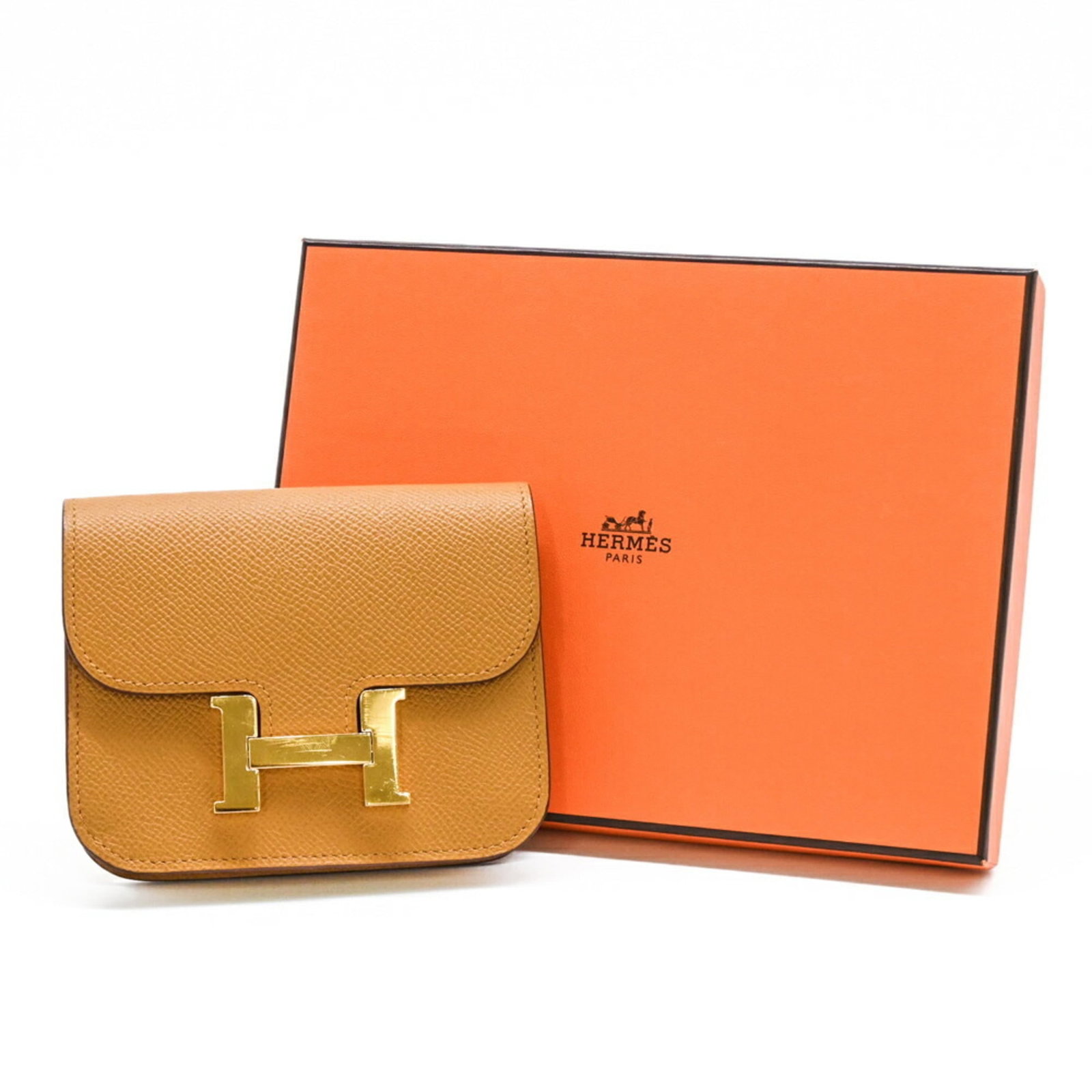 Hermes Coin Purse/Coin Case Epsom Leather: Hermes Coin Purse/Coin Case Epsom Leather The Hermes Coin Purse/Coin Case Epsom Leather features a rich brown color and classic design, showcasing the iconic brand's attention to detail. Made from