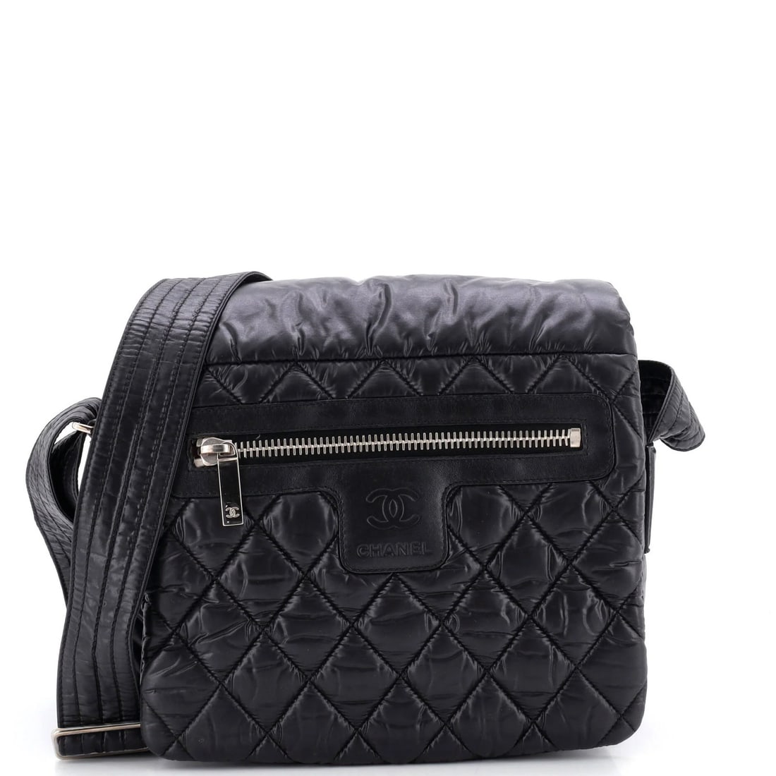 Coco Chanel Medium Nylon Quilted Cocoon Messenger Bag: Coco Chanel Medium Nylon Quilted Cocoon Messenger Bag The Coco Chanel Medium Nylon Quilted Cocoon Messenger Bag boasts a sleek black exterior with minor creases and a sturdy quilted nylon design.