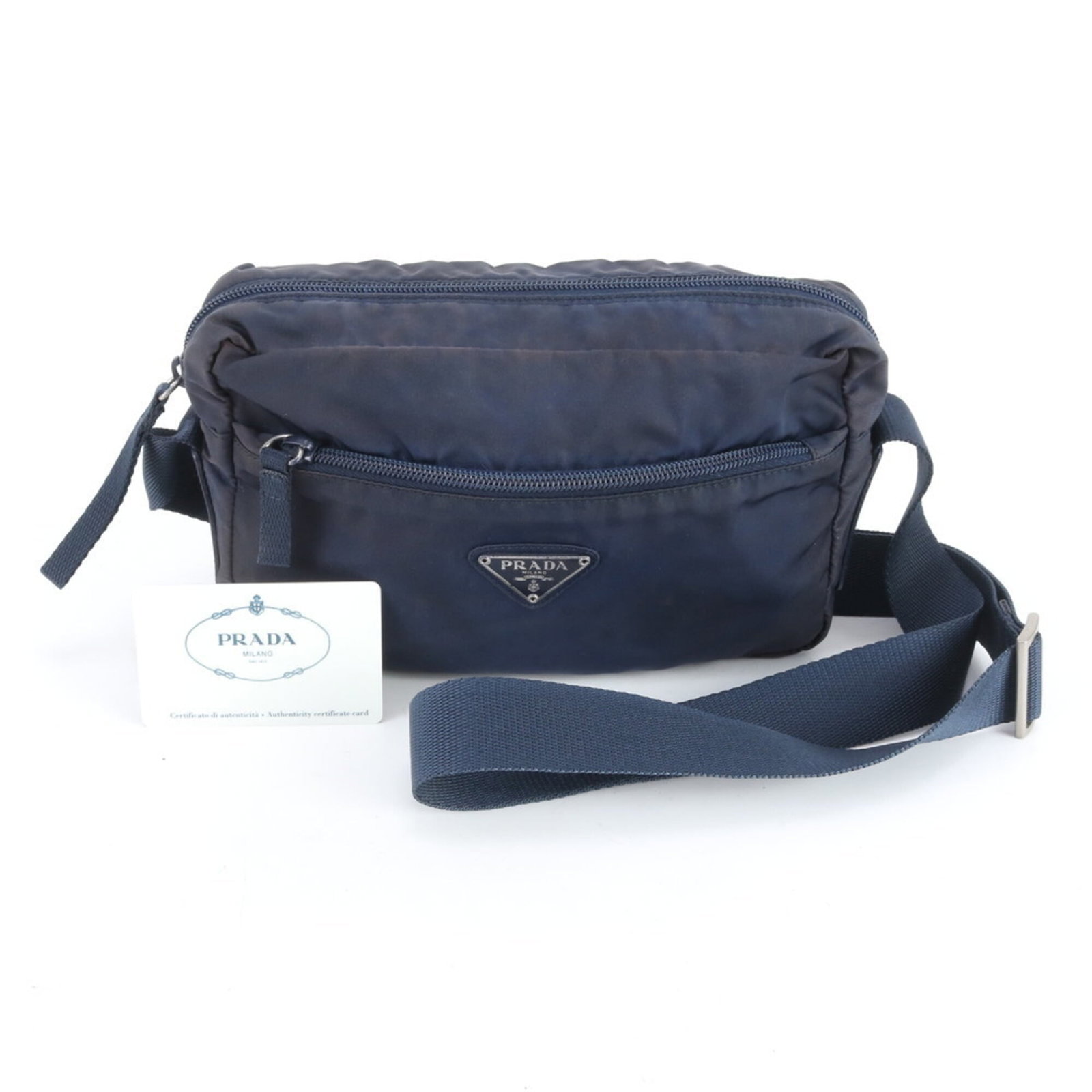 Prada Shoulder Bag Nylon: Prada Shoulder Bag Nylon Navy Prada Nylon Shoulder Bag in good used condition. The bag features a durable nylon material and measures 14cm x 23cm x 7cm, making it a practical size for daily use. A few
