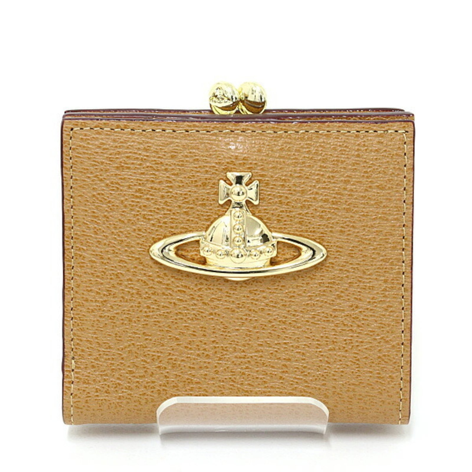 Vivienne Westwood Wallet (Bi-Fold) Leather: Vivienne Westwood Wallet (Bi-Fold) Leather This Vivienne Westwood bi-fold leather wallet features a gold and light brown color combination. Made from high-quality leather, its compact size measures 9c