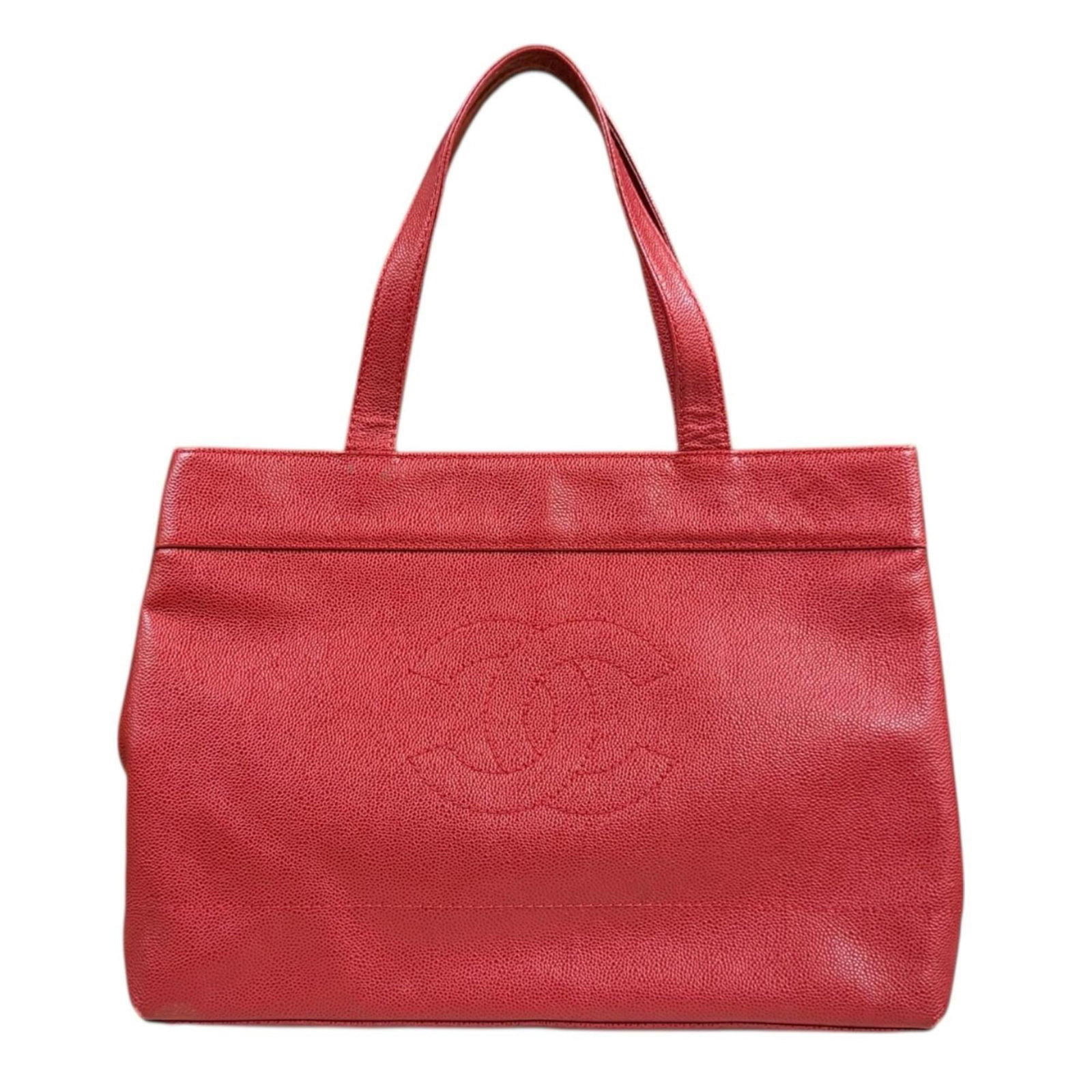 Chanel Tote Bag Grained Calfskin: Chanel Tote Bag Grained Calfskin The Chanel Tote Bag Grained Calfskin boasts a striking red hue and sleek design, making it a timeless addition to any wardrobe. With its durable magnet closure and ver