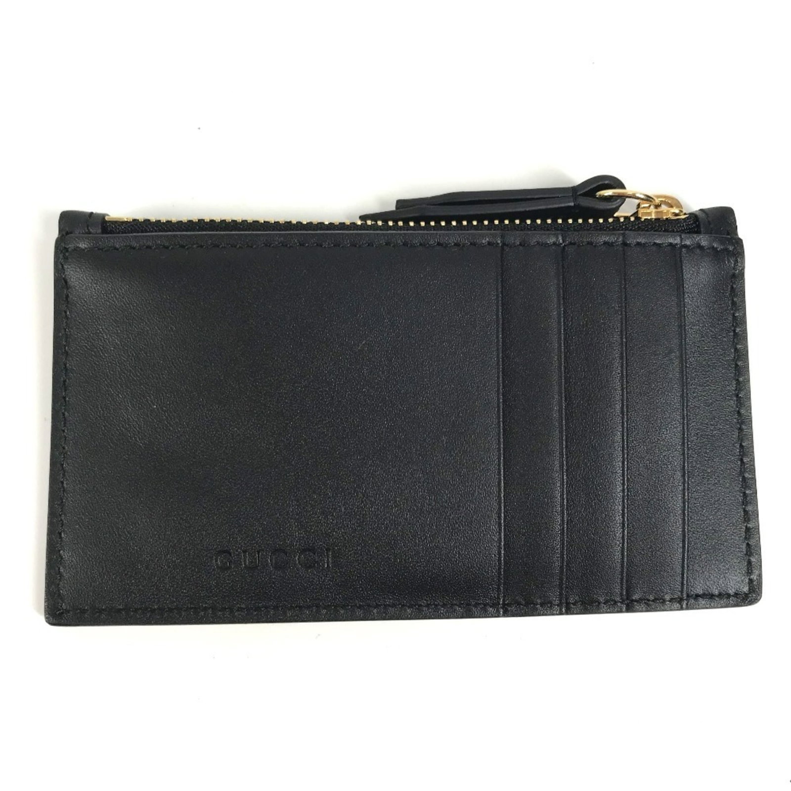 Gucci Coin Purse/Coin Case Leather: Gucci Coin Purse/Coin Case Leather Gucci Coin Purse/Coin Case Leather is made from high-quality leather and features a sleek black design. The compact size of 6.5cm x 13cm / 2.55'' x 5.11'' makes it e
