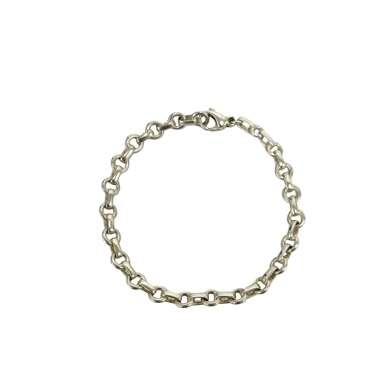Tiffany Charm Bracelet Silver 925: Tiffany Charm Bracelet Silver 925 Silver 925 charm bracelet from Tiffany, featuring a classic design with subtle signs of wear. The 19cm length provides a comfortable fit, while the silver finish reta